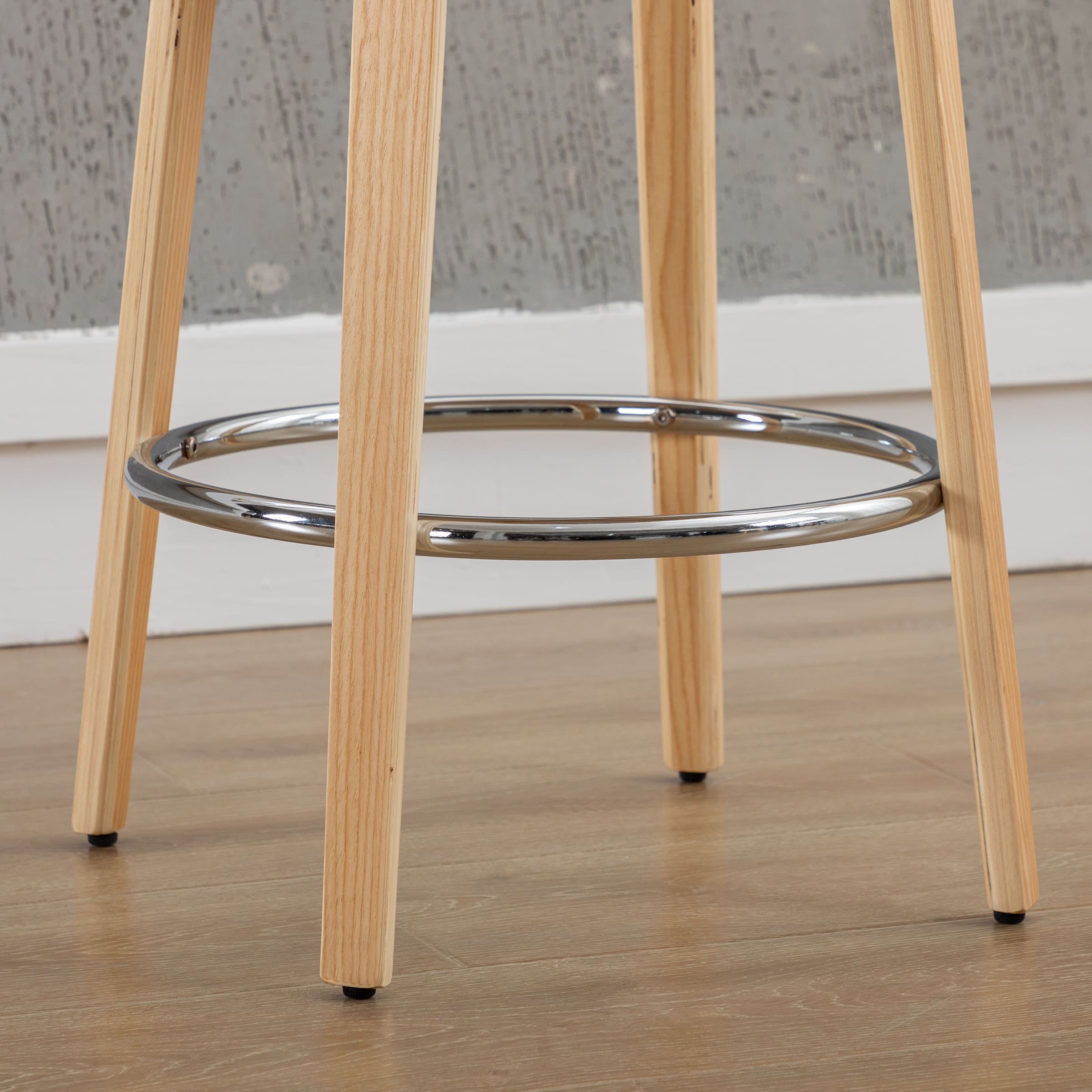 Chrome footrest ring around stool legs