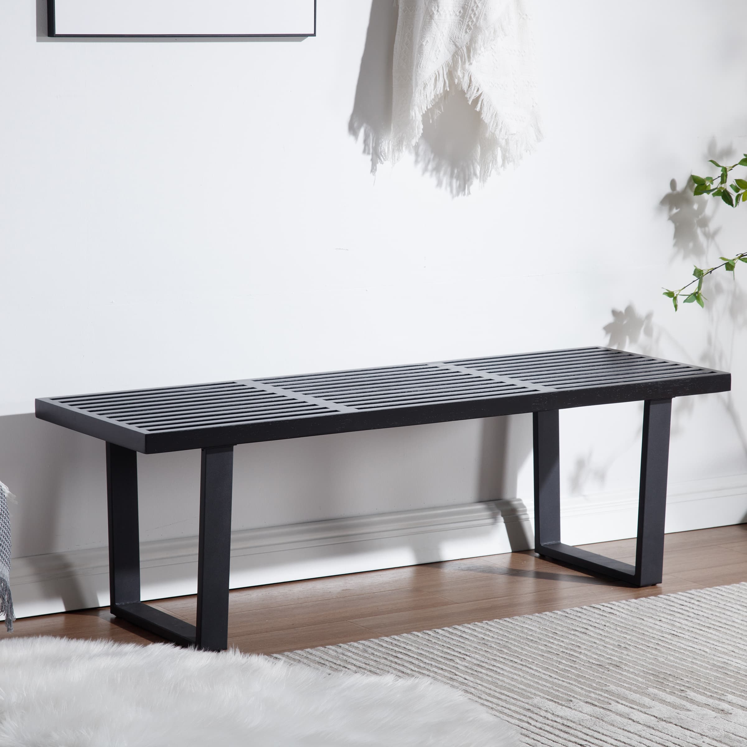 Another side angle of black slatted bench