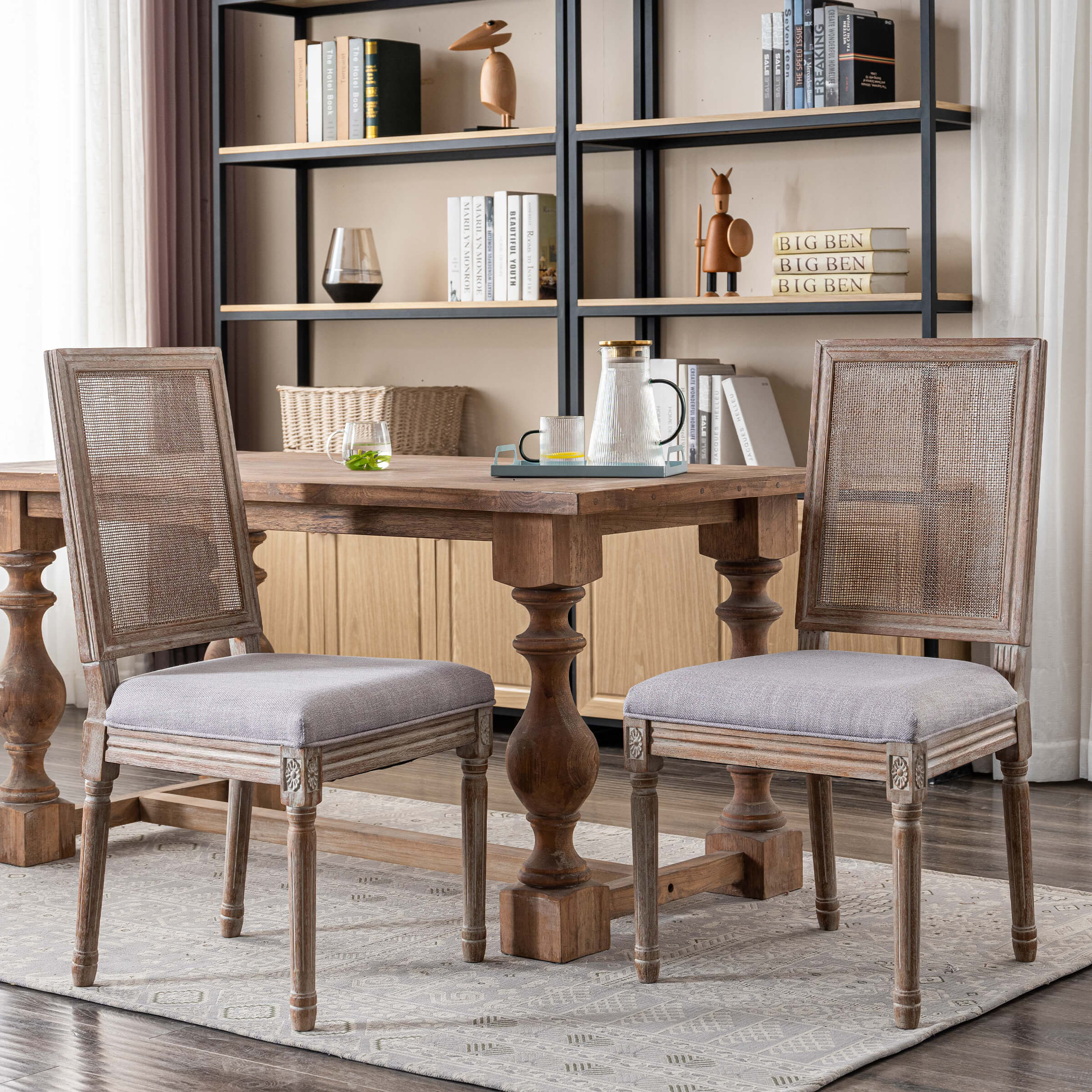Dining chairs around a table in a room