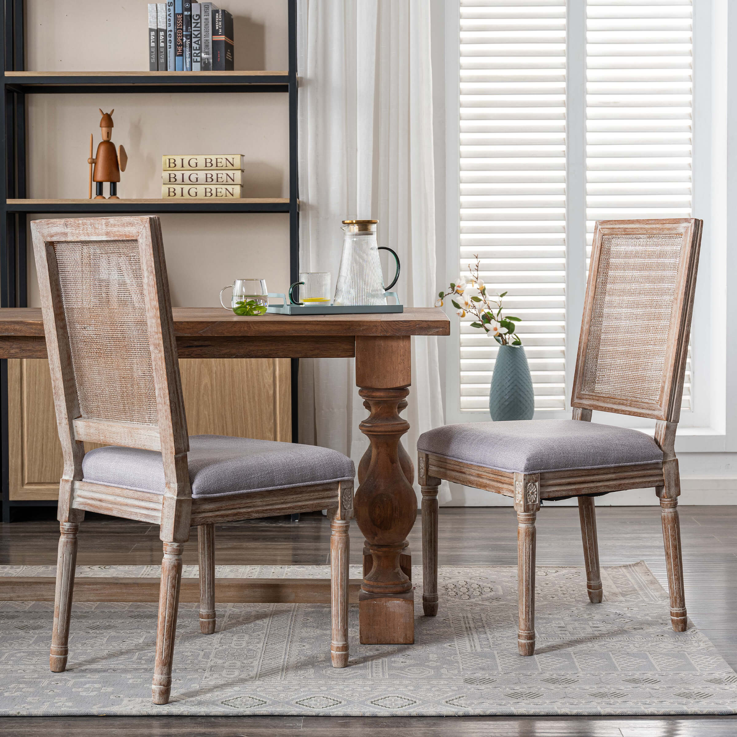Two dining chairs facing camera