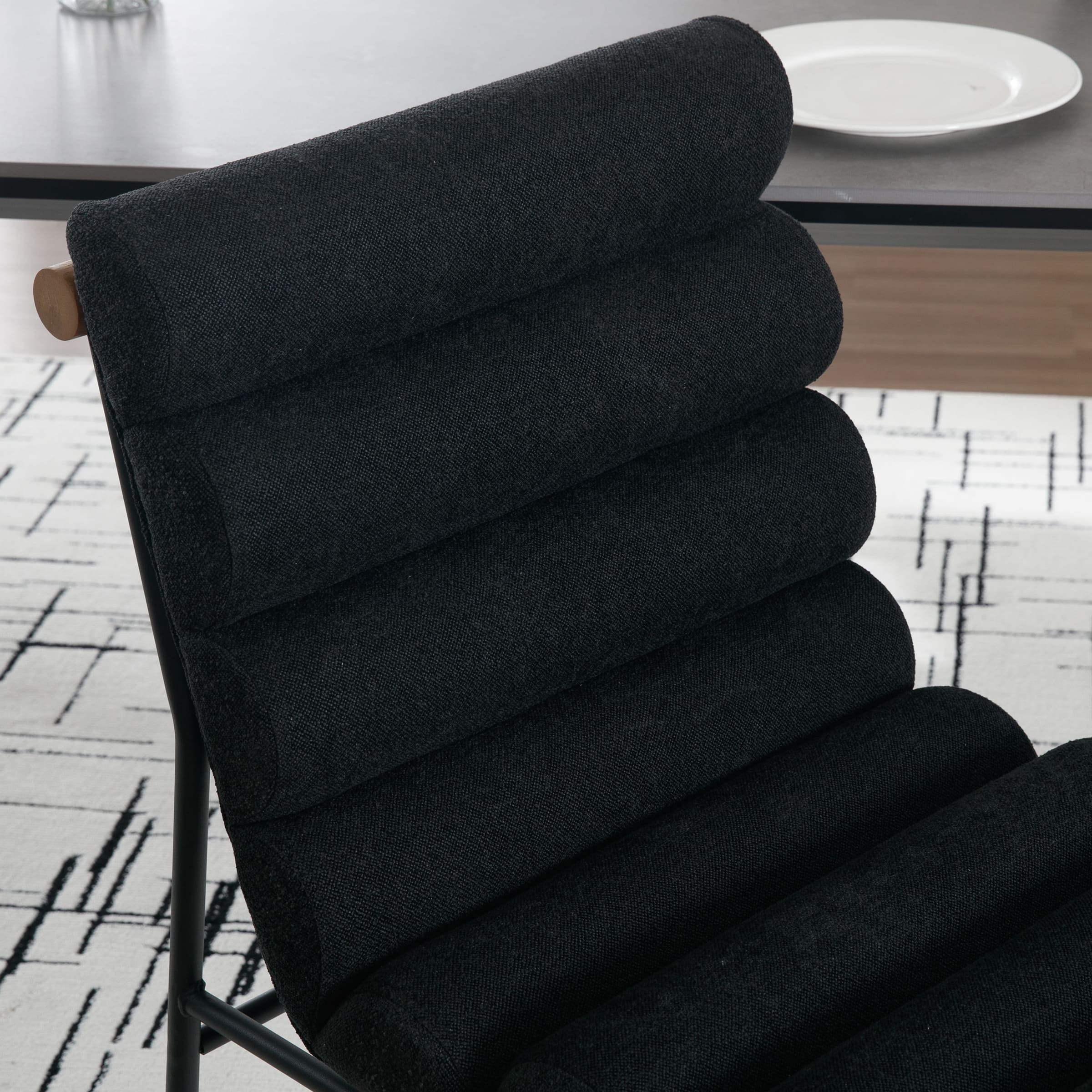 Close-up of black upholstered chair cushion