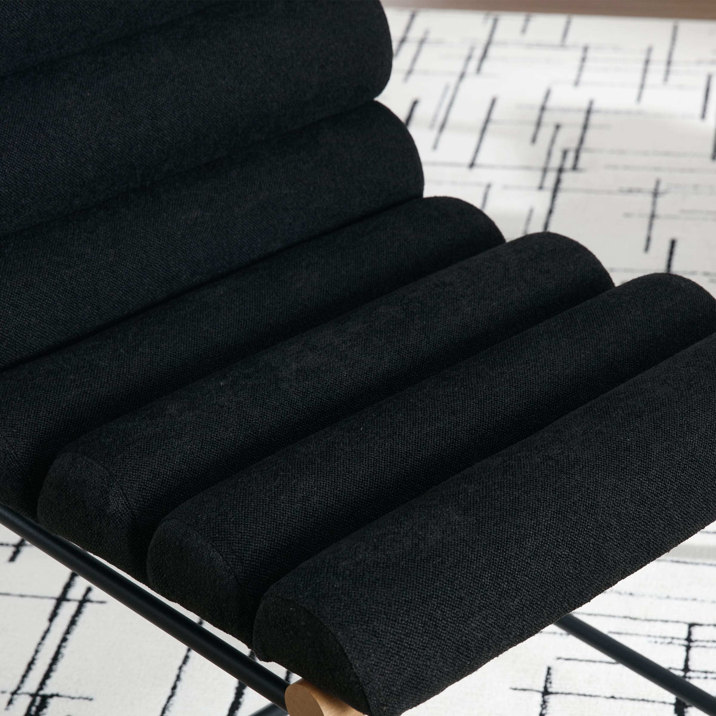 Close-up of black upholstery on chair seat cushions