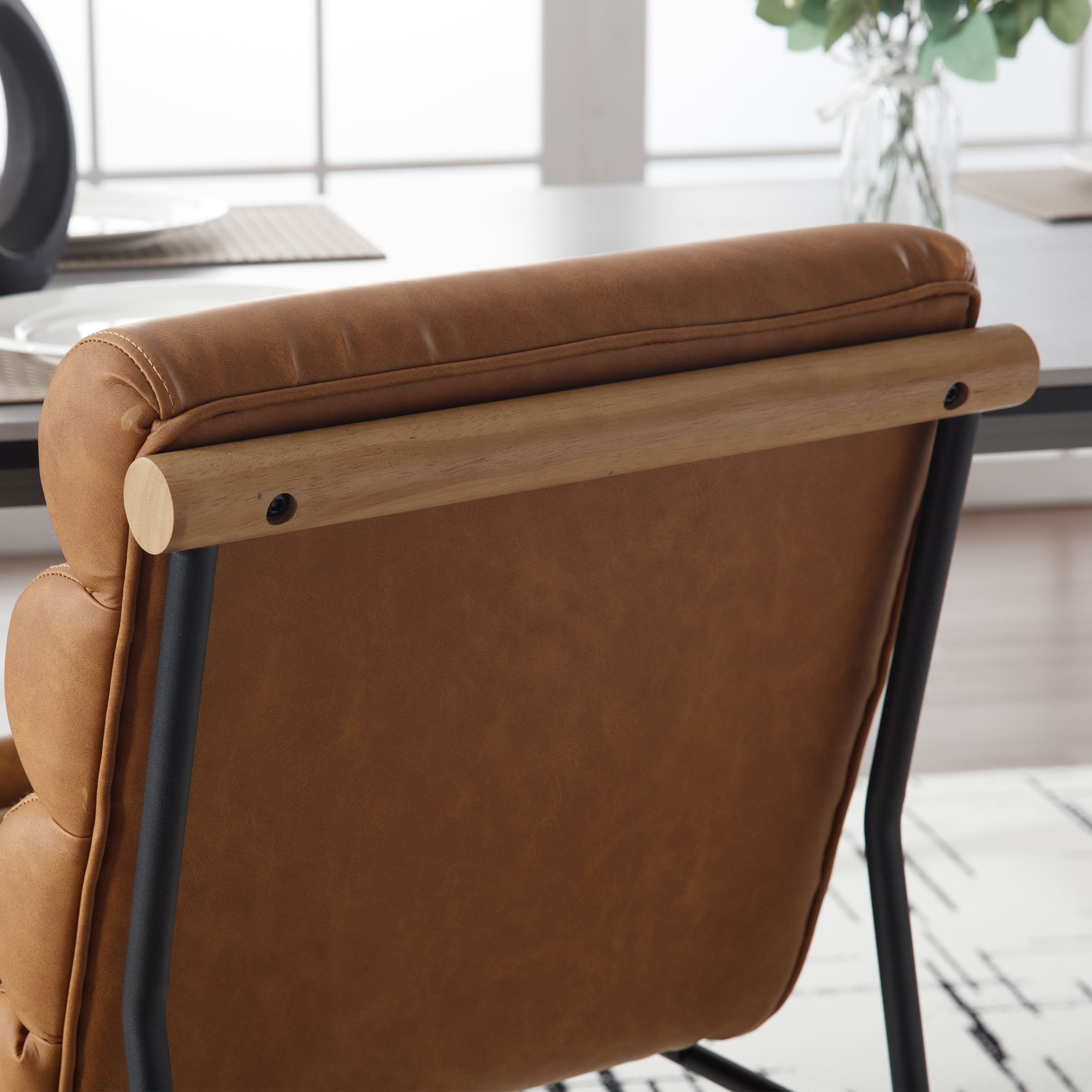 Back of chair with wooden cylindrical armrest
