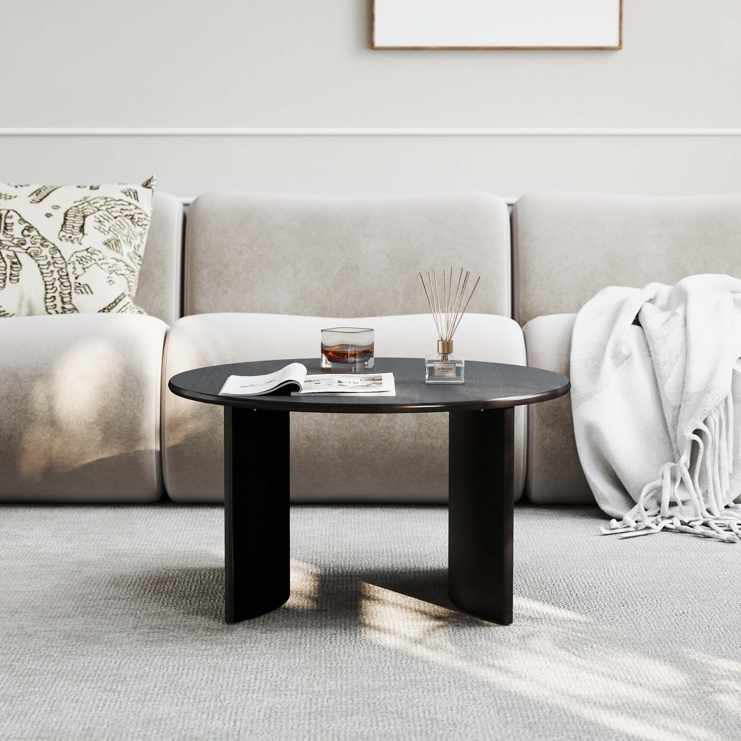 Round coffee table in living room with cup
