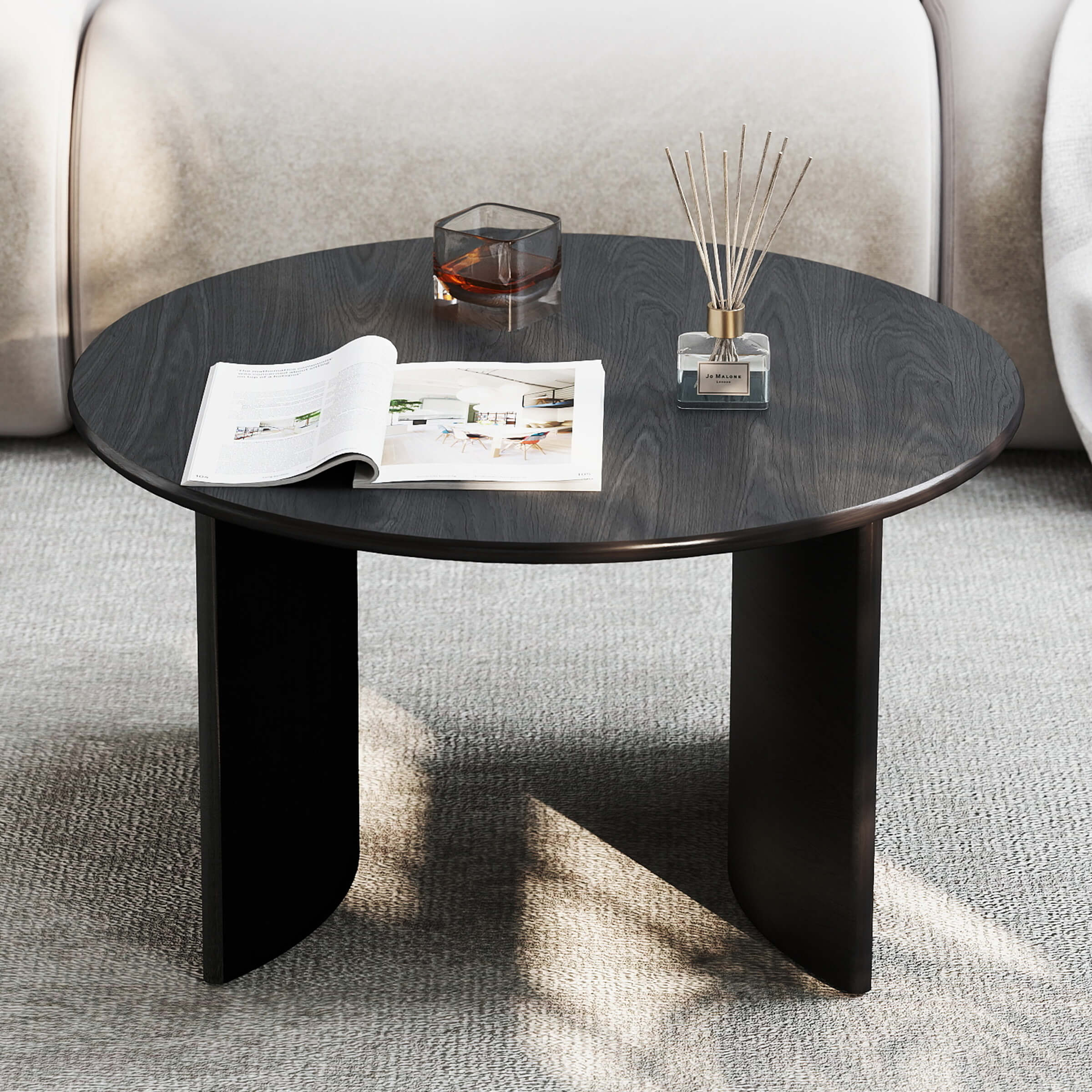 Round black coffee table in living room