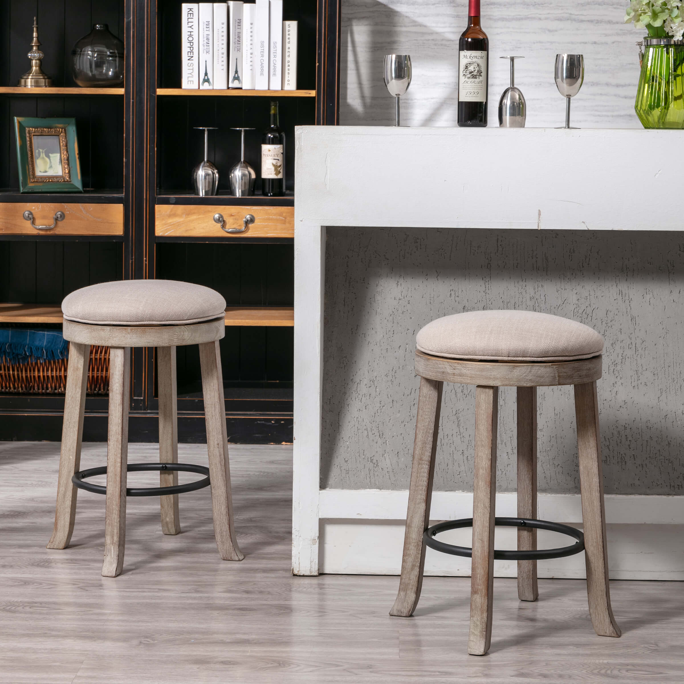 Two upholstered round backless stools in a kitchen/bar setting