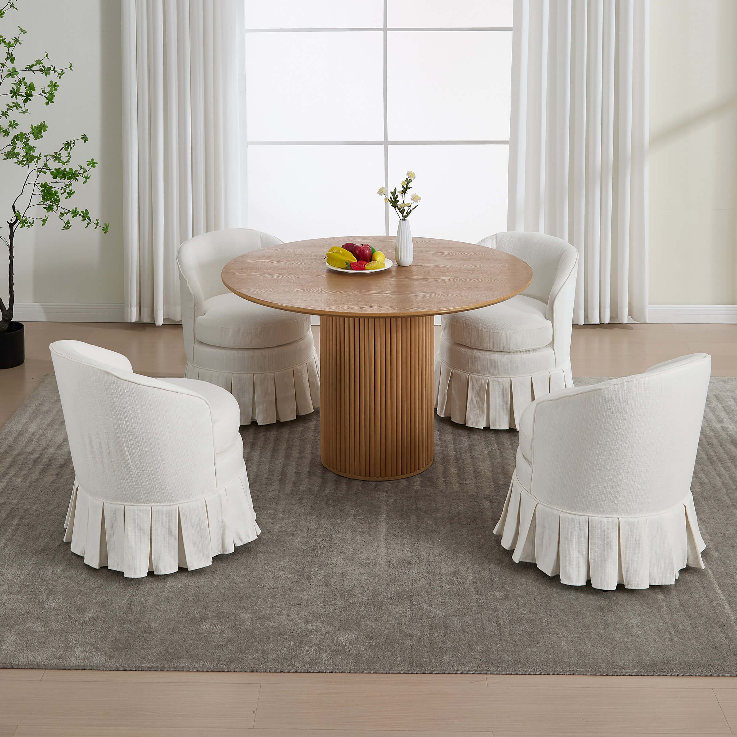 Round table with four white chairs