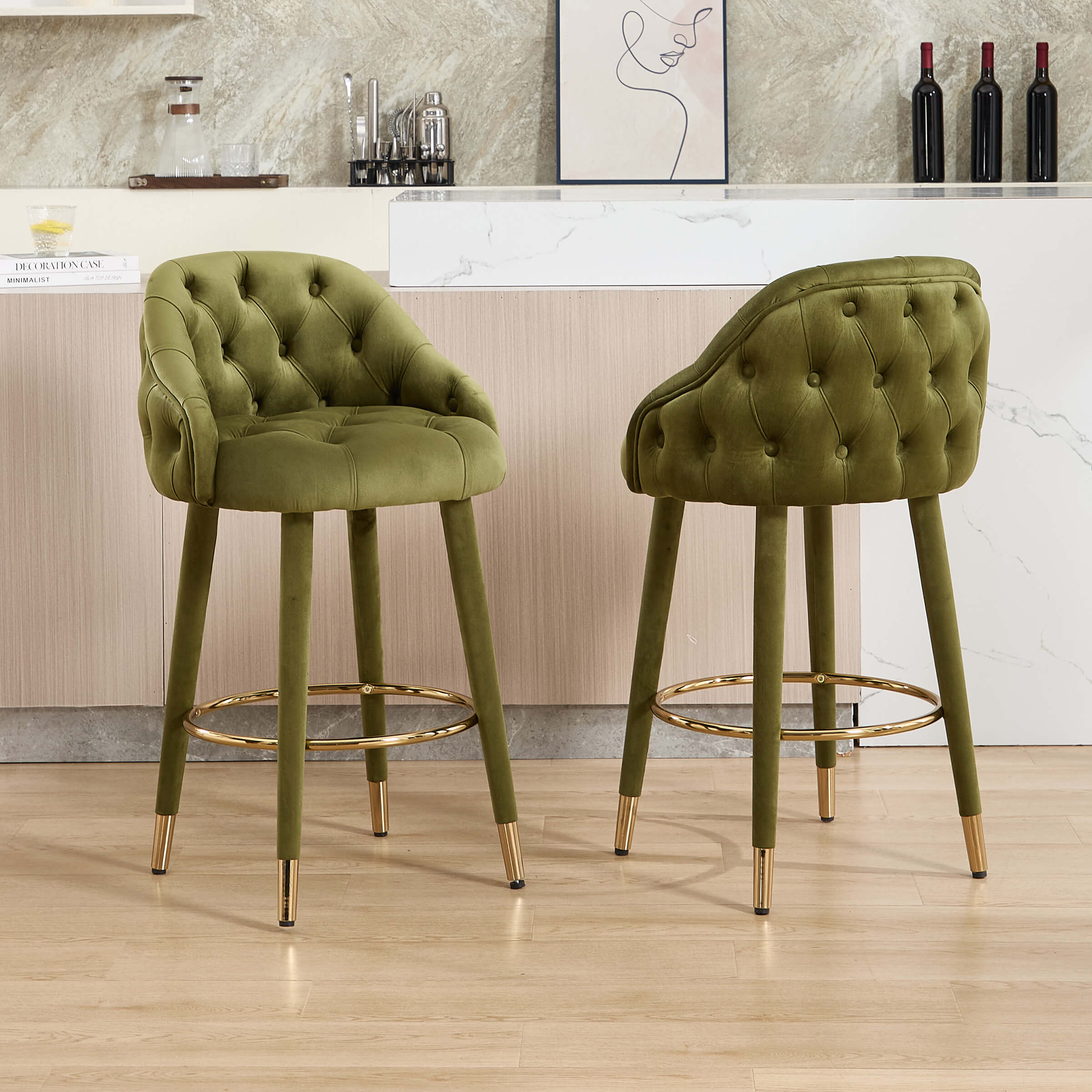 Two green velvet bar stools facing camera