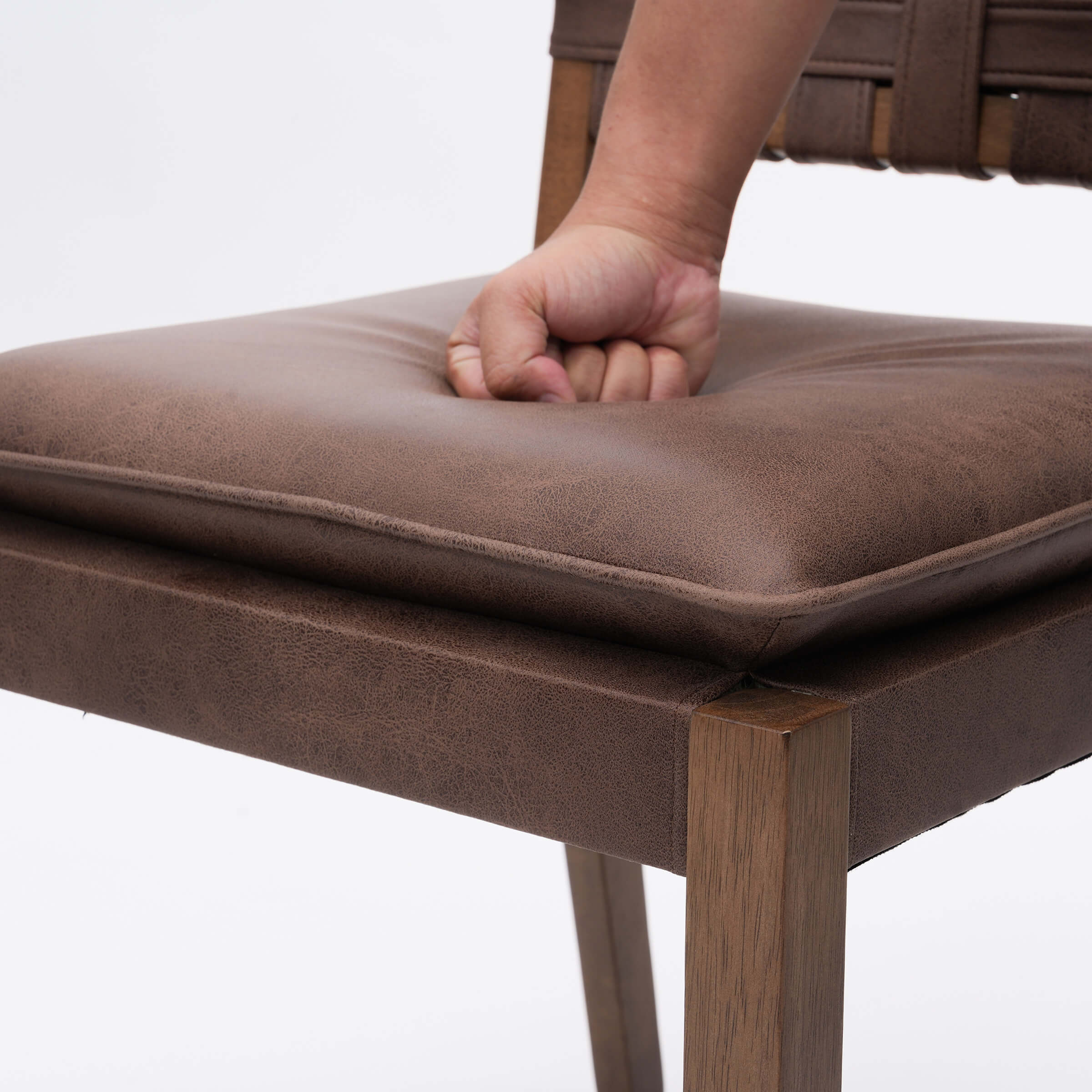 Close-up of cushion with hand
