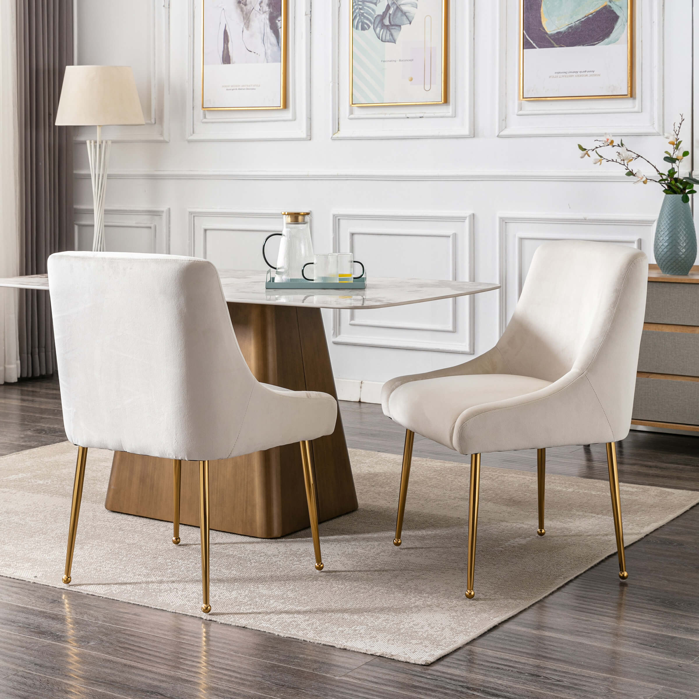 Cream chairs around marble table in bright room