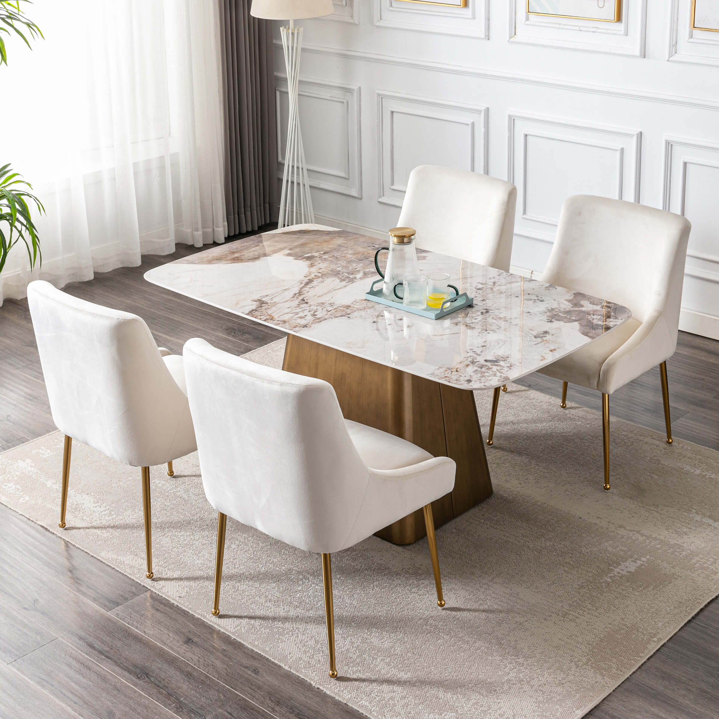Cream chairs around a marble dining table viewed from above