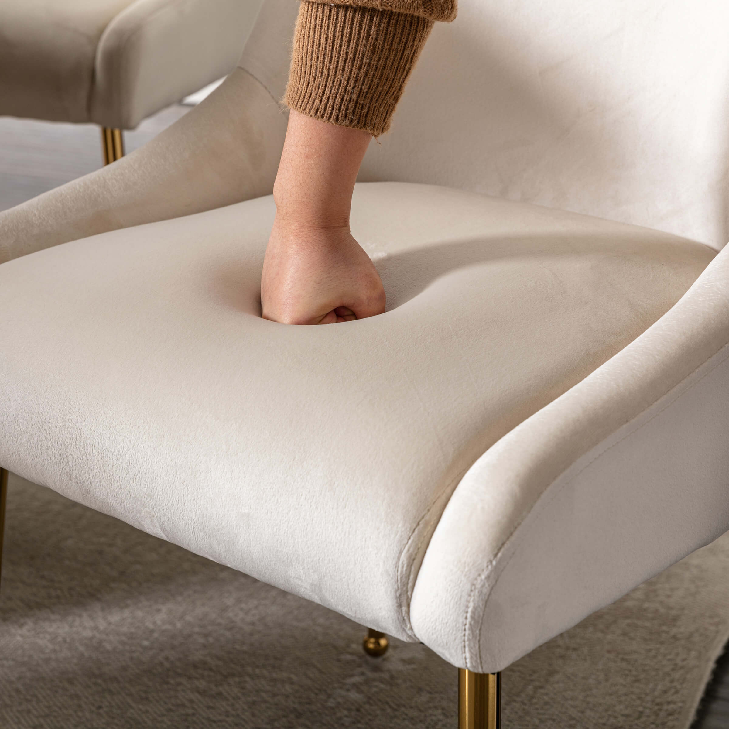 Close-up of cream chair arm and padding
