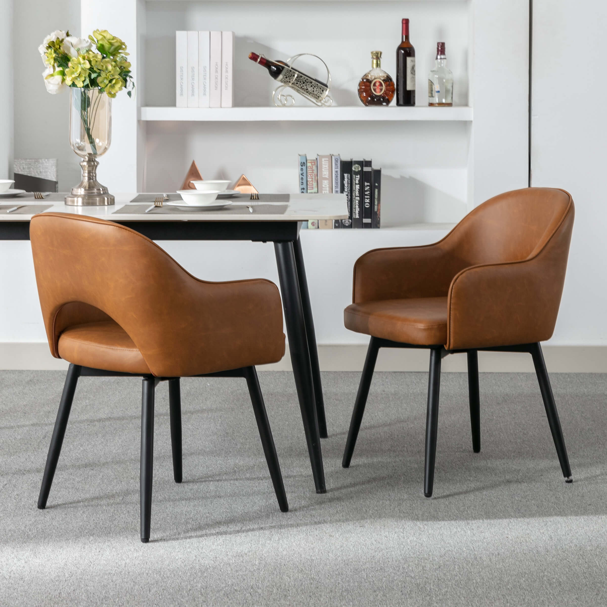 Two chairs with table in room