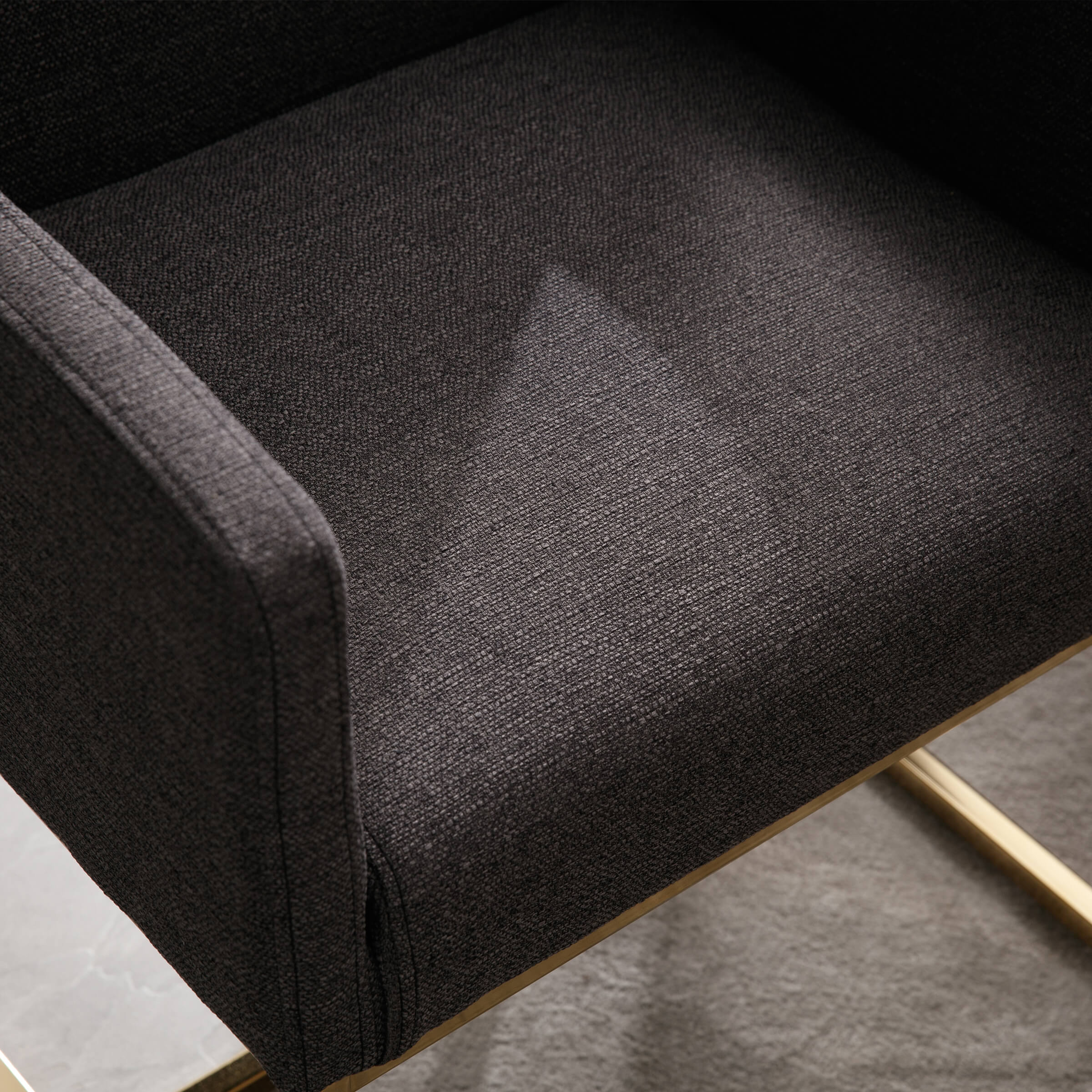 Close-up of dark gray textured fabric upholstery