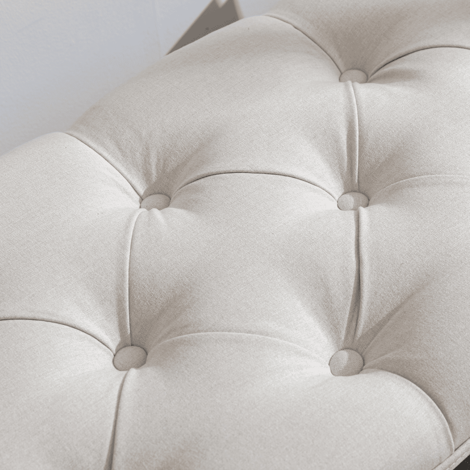 Tufted cushion close-up two buttons