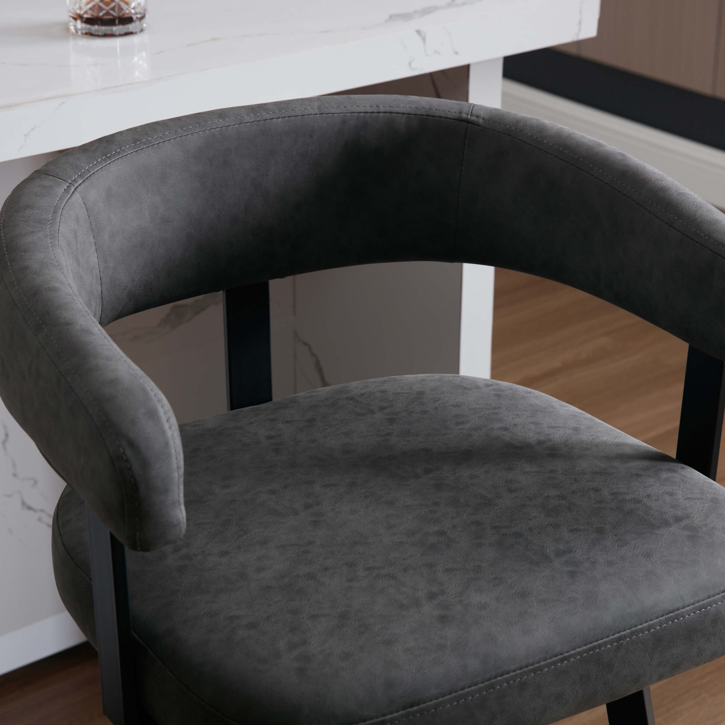 Close-up of gray upholstery and stitching