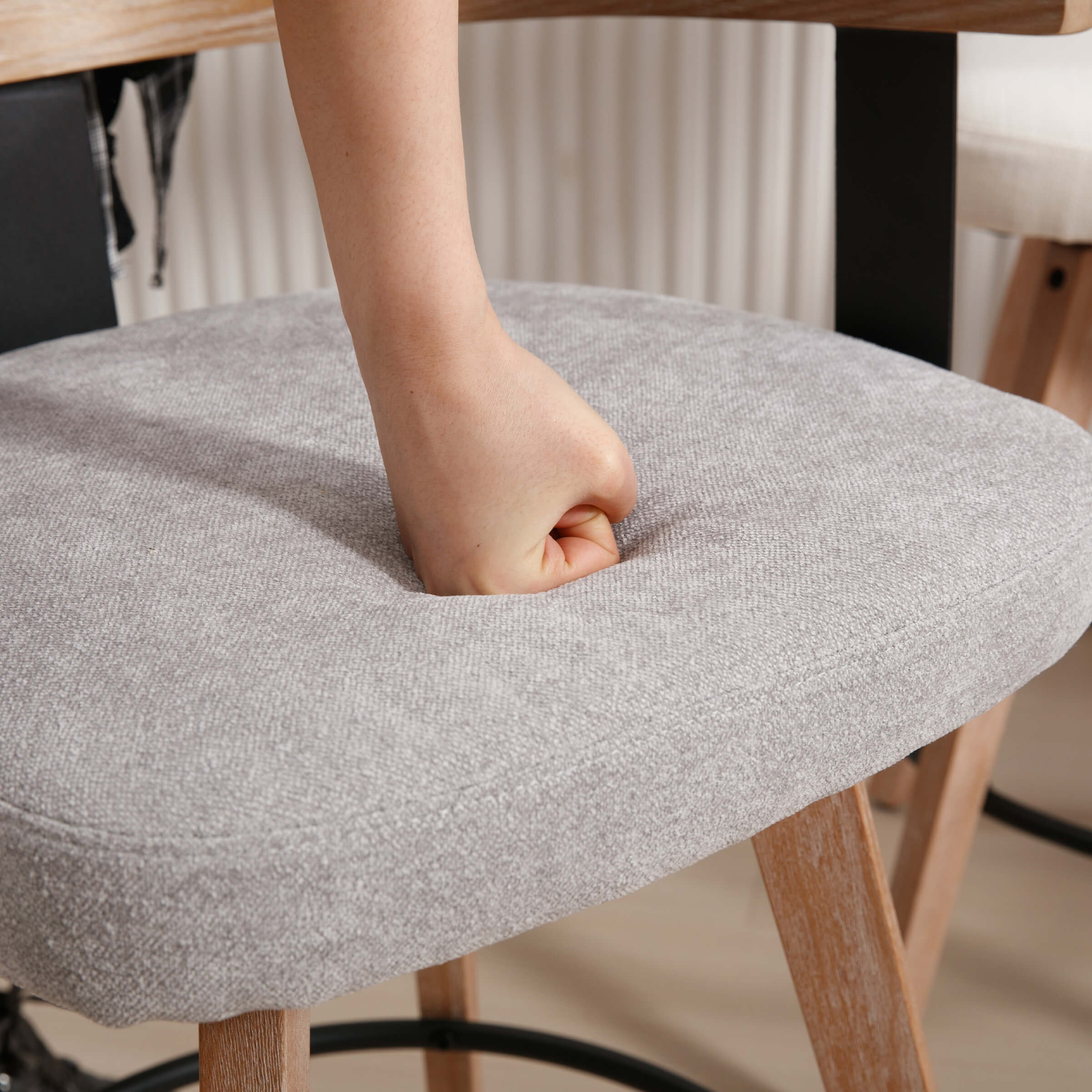 Person pressing cushion