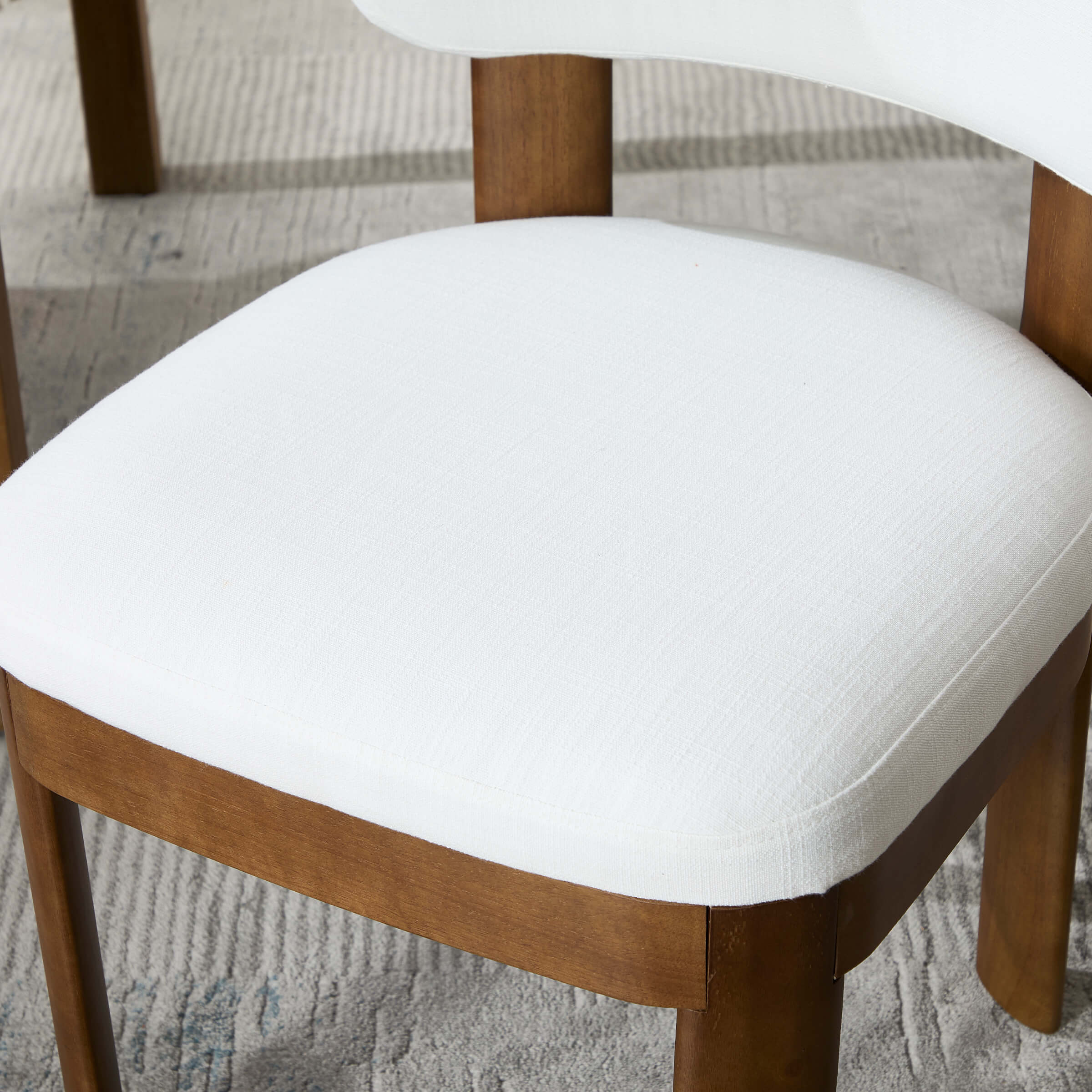 White upholstered seat and wooden frame
