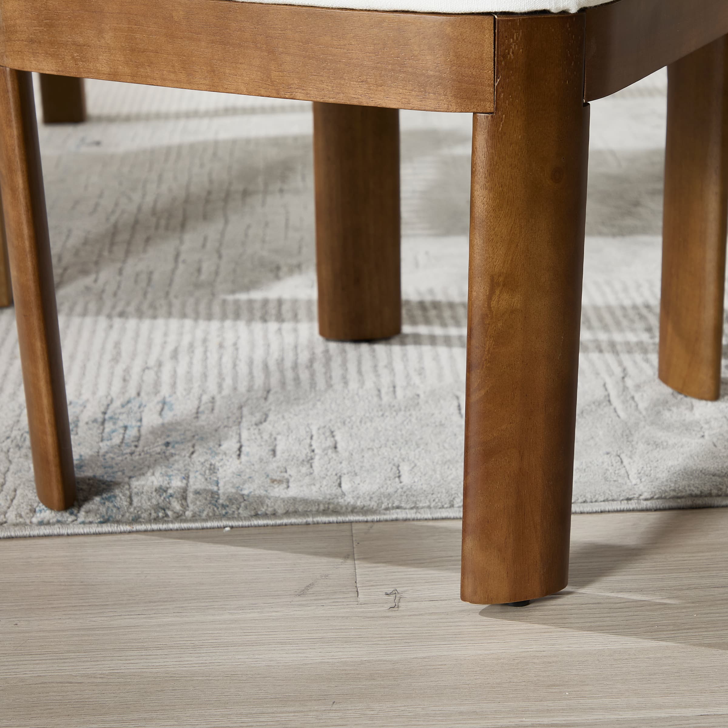 Wooden chair leg close-up with black finish