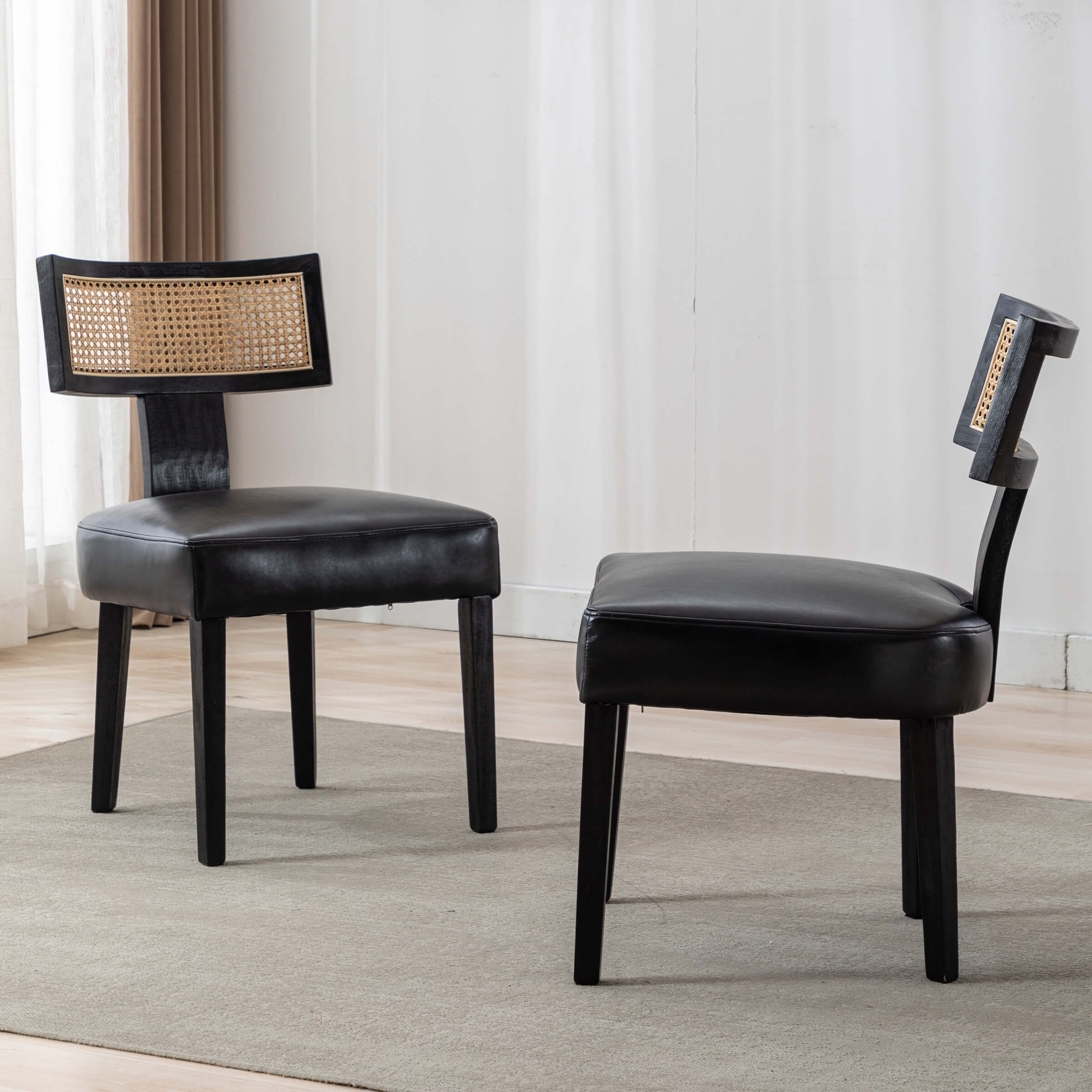 Two black chairs around table
