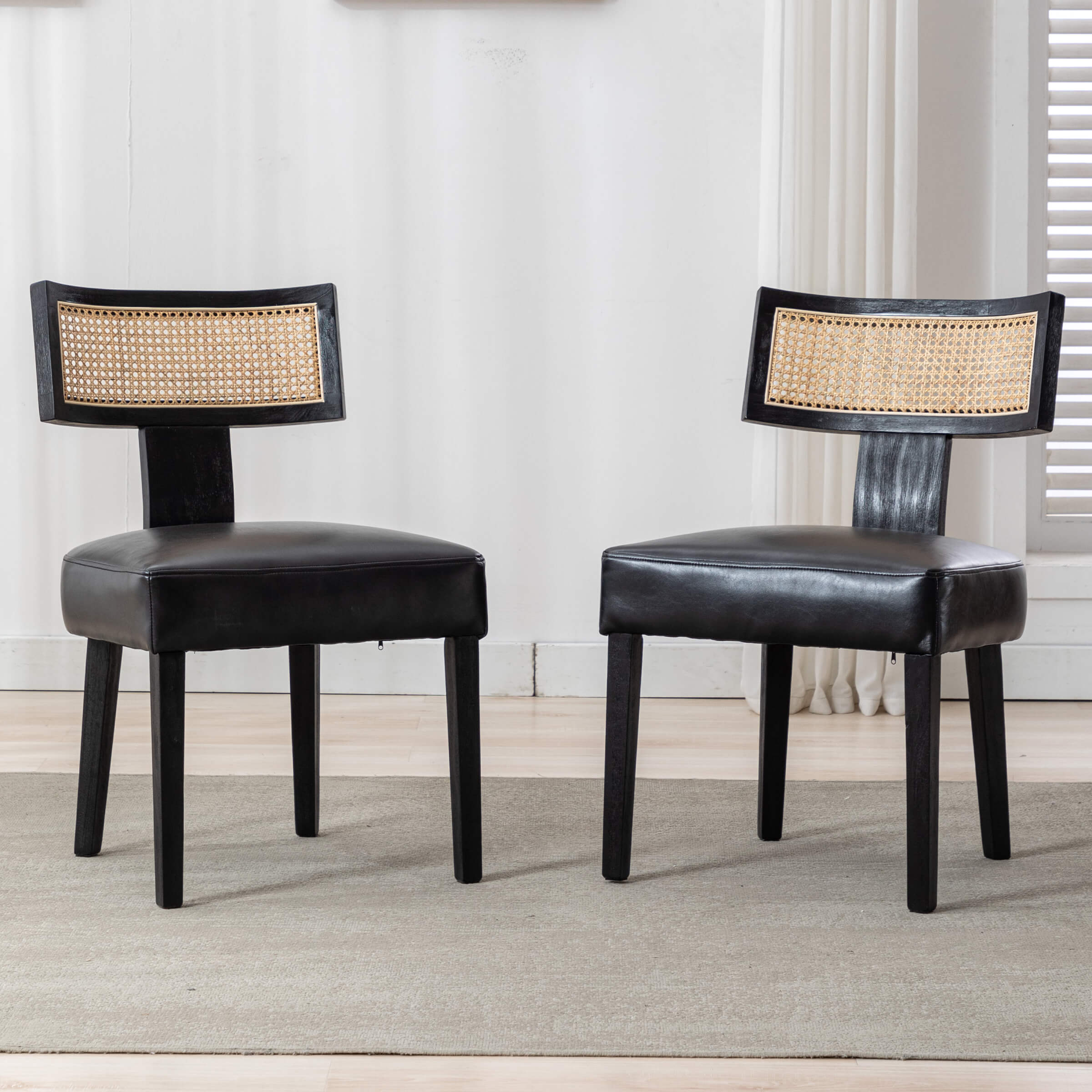 Two chairs with black frames