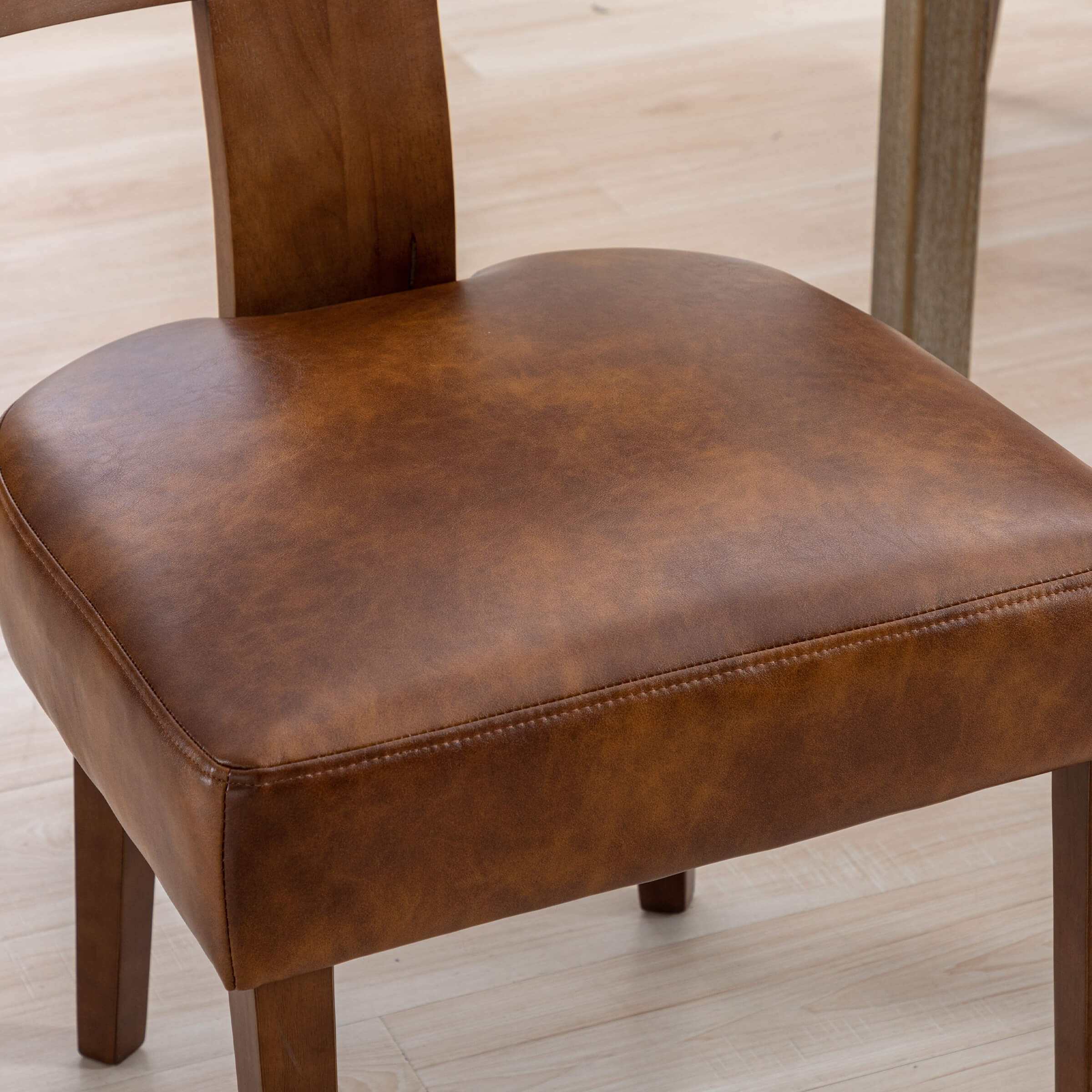 Close-up of leather seat and stitching