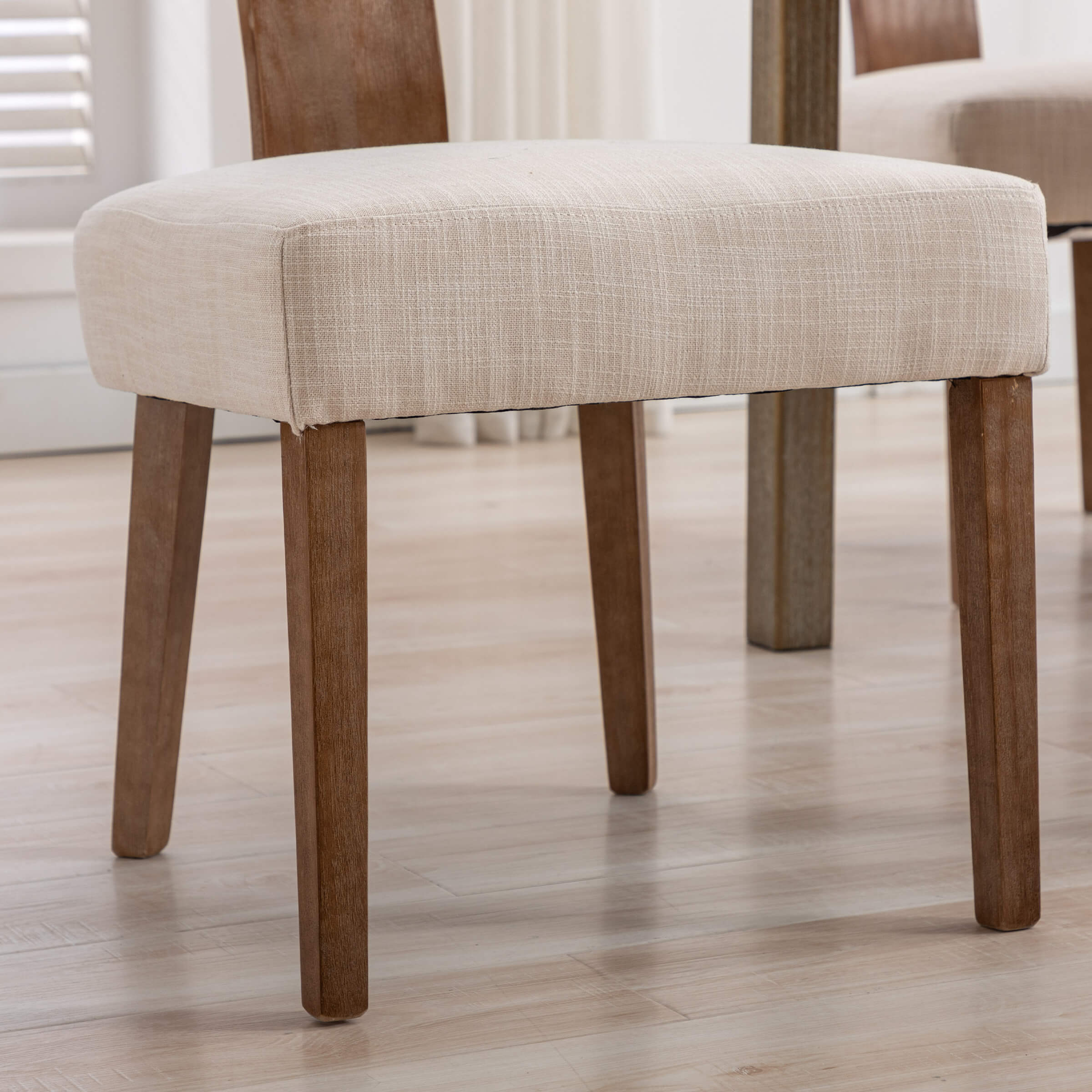 Leg and upholstery close-up of chair