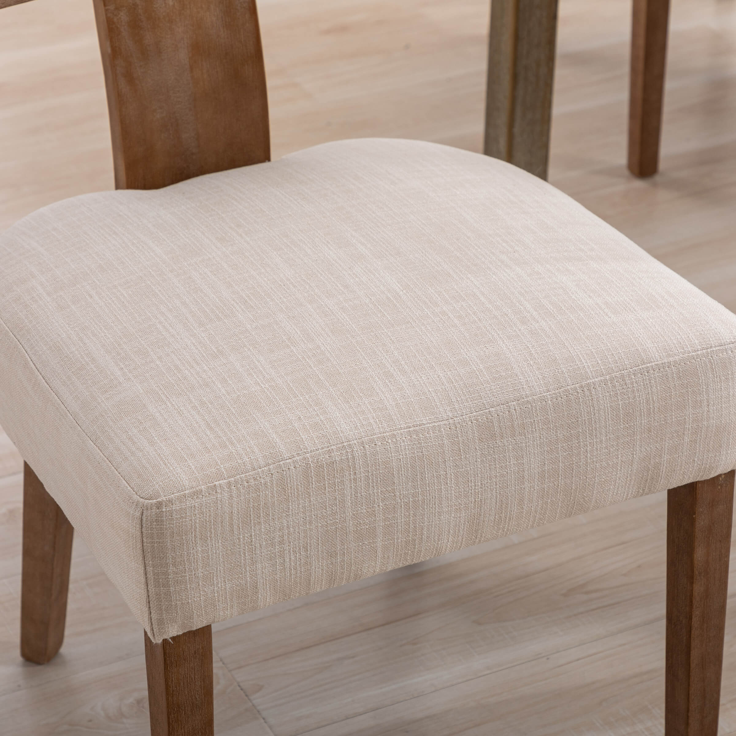 Seat cushion close-up showing beige fabric