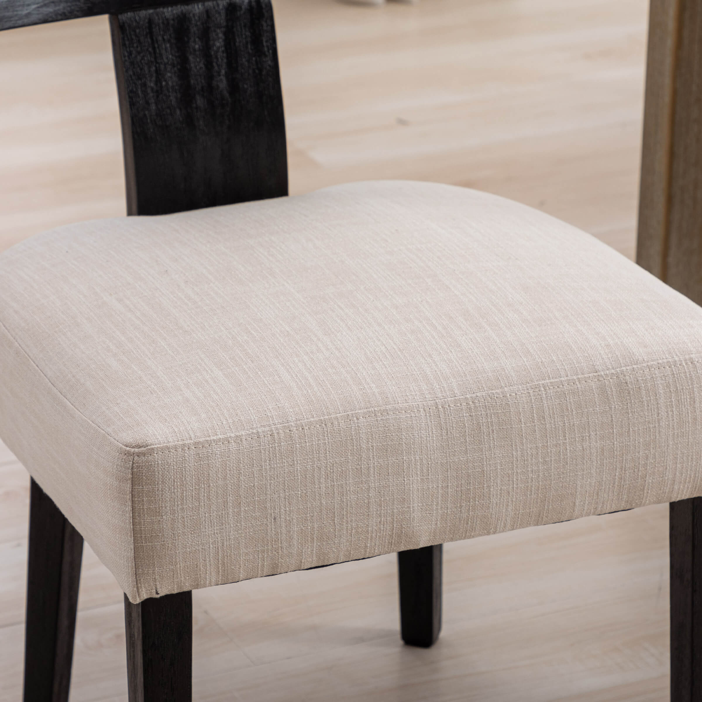 Close-up of chair leg and upholstery