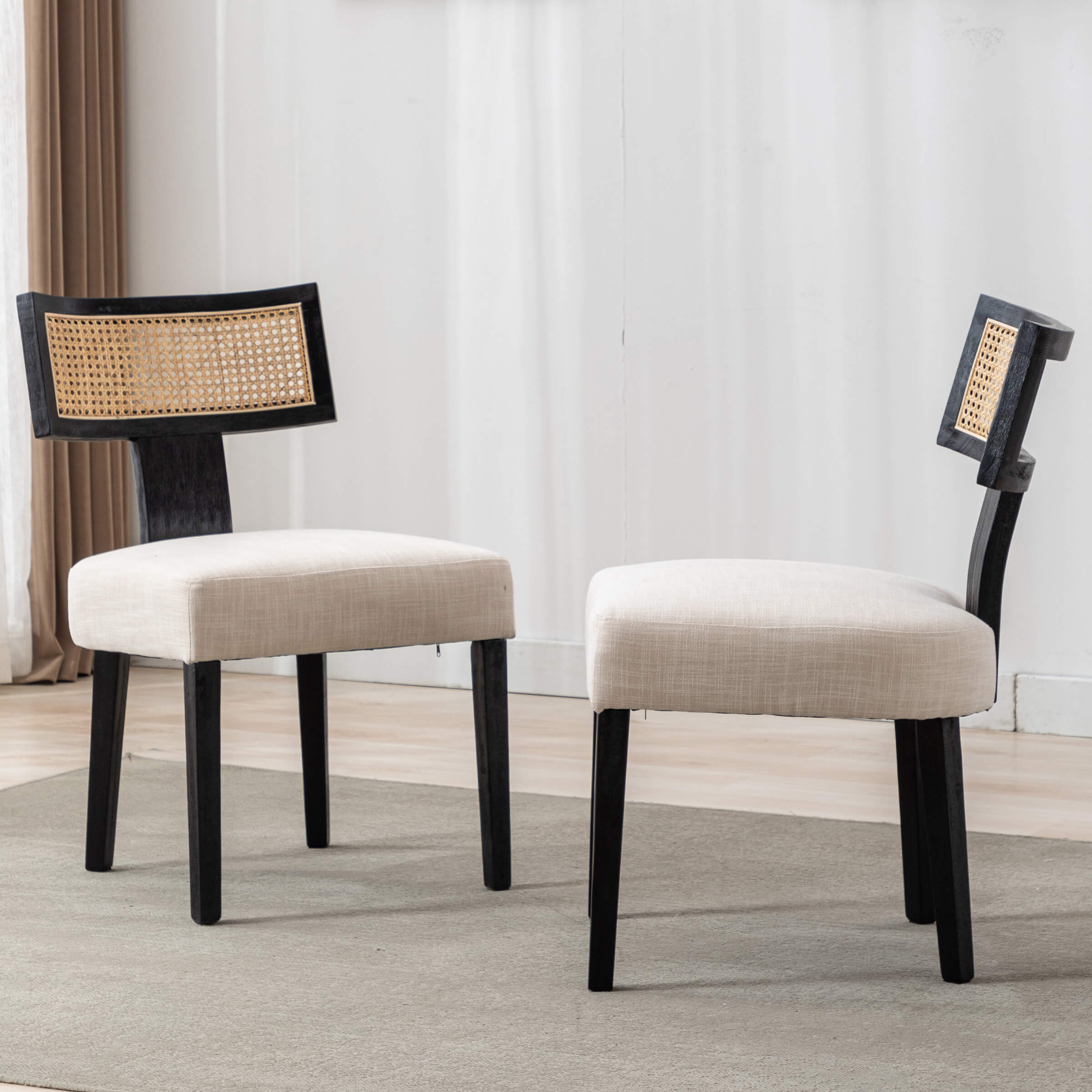 Two chairs with beige cushions
