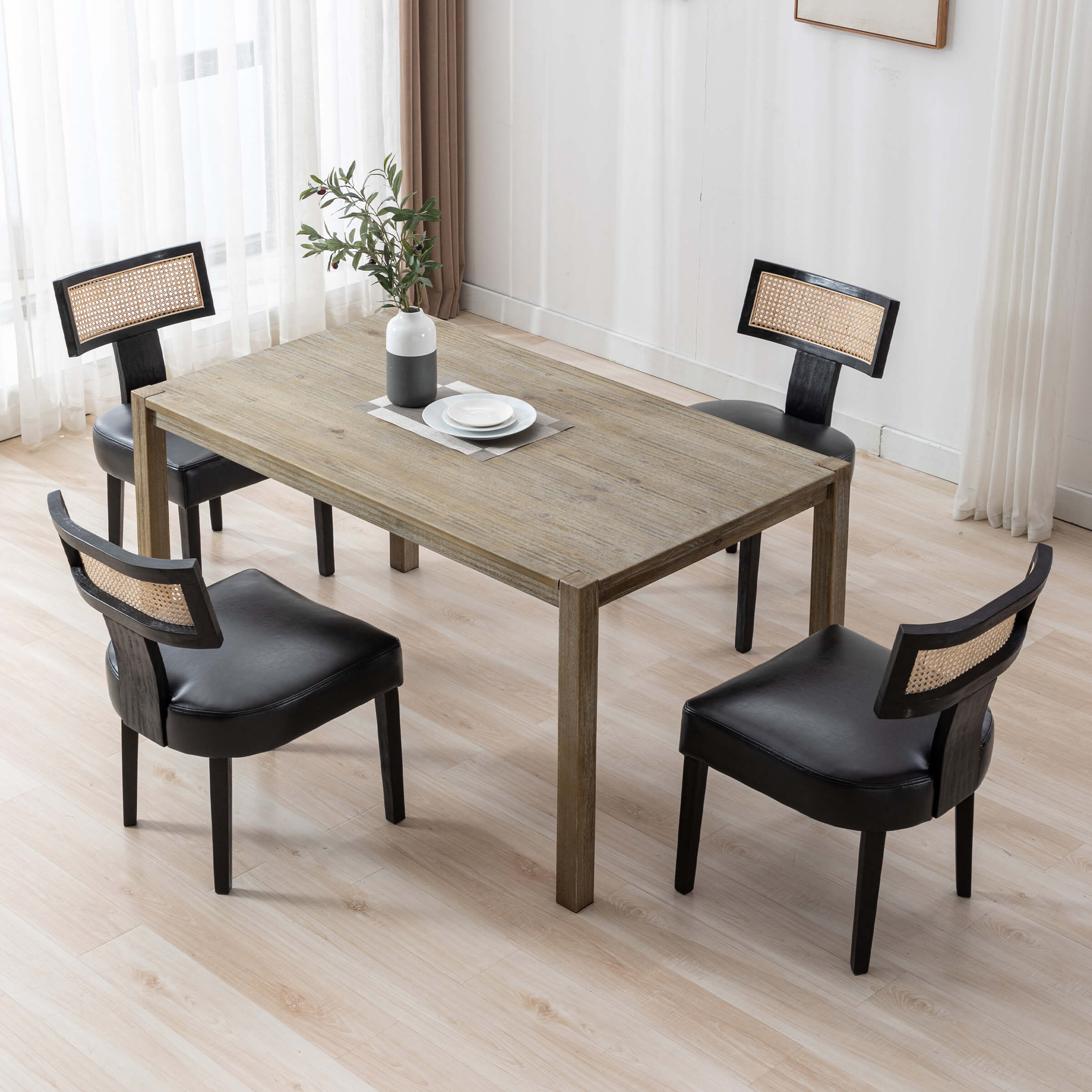 Dining room set with four chairs around table