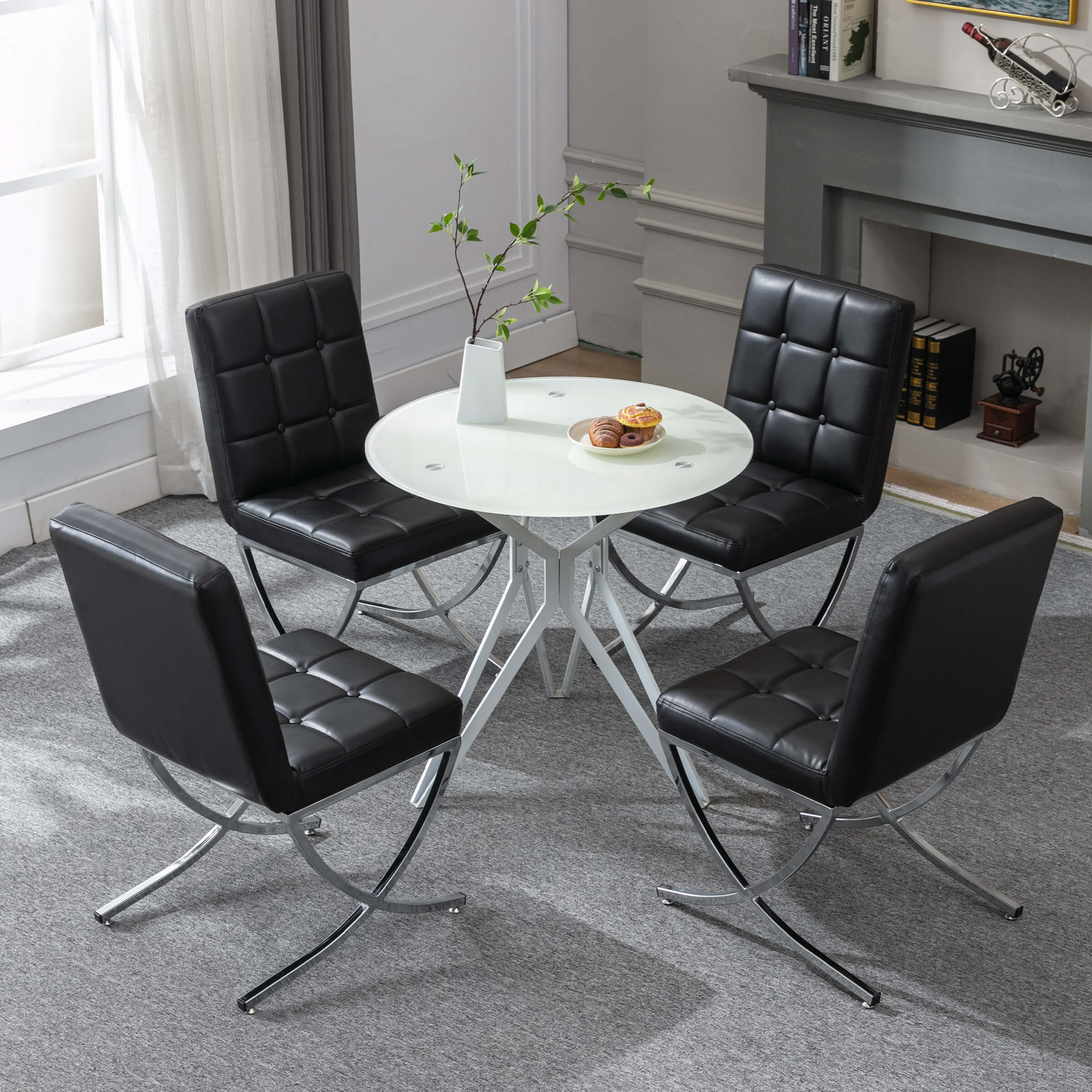 Chairs set around round table in bright room