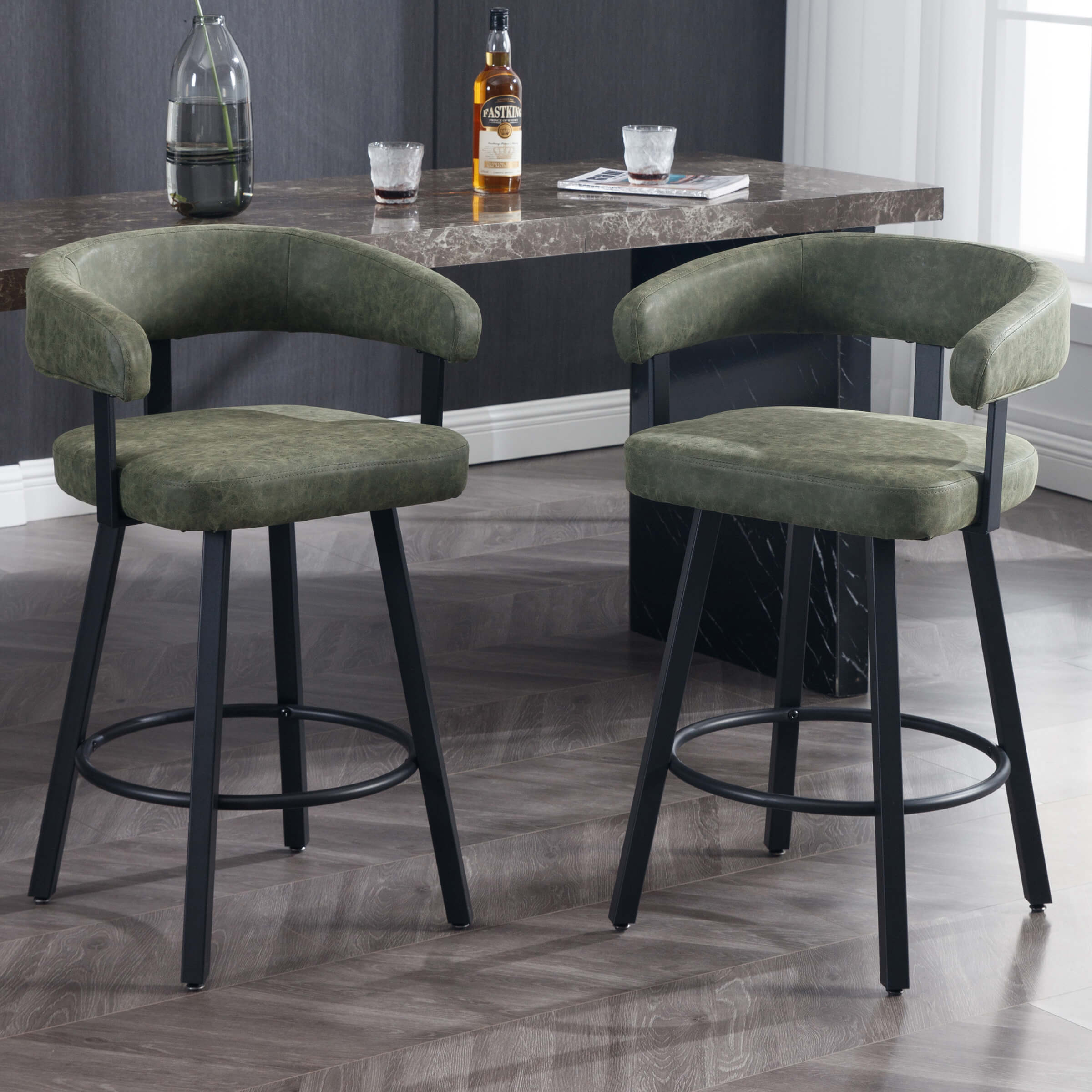 Pair of green bar stools near a marble-top island