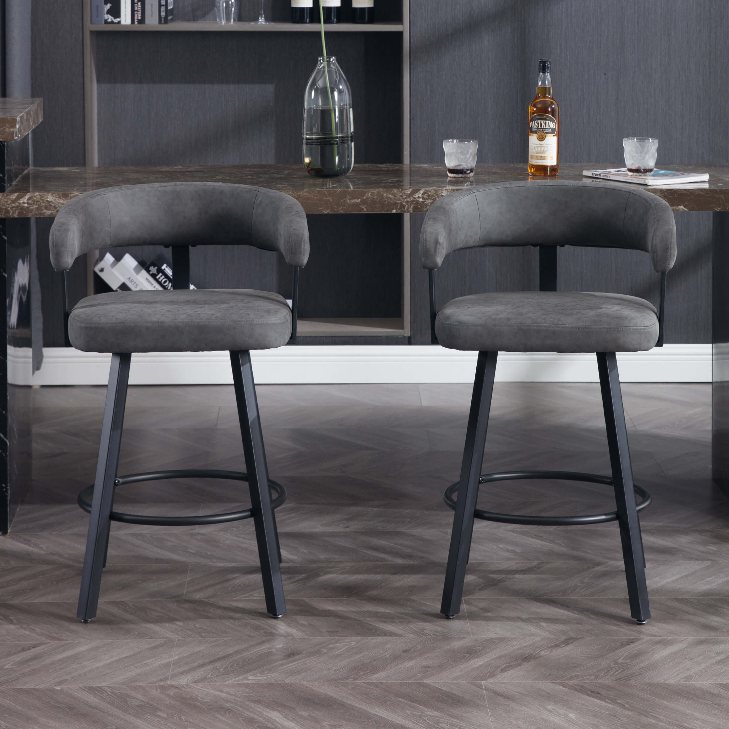 Two gray bar stools in showroom setting
