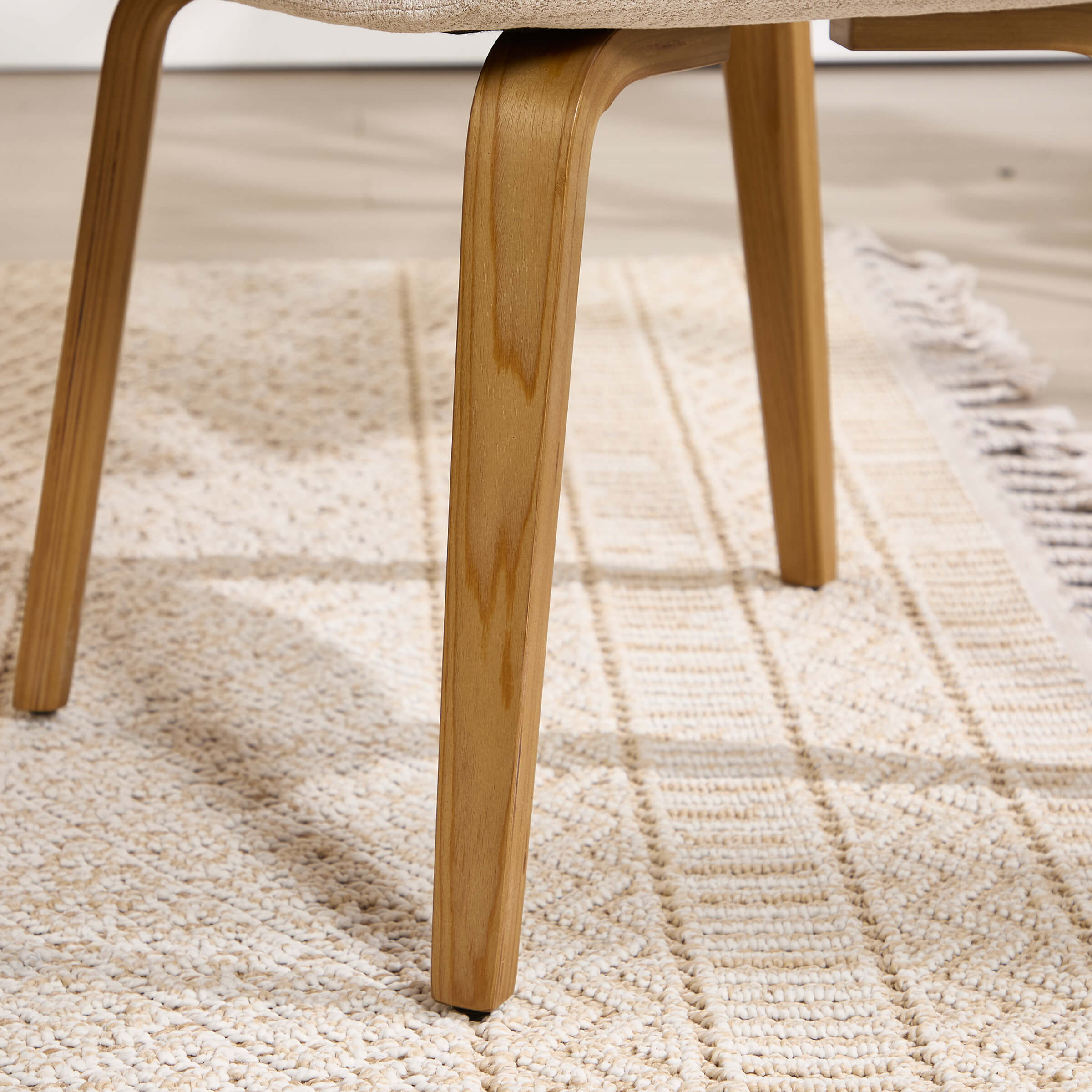 Chair leg close-up with wood finish
