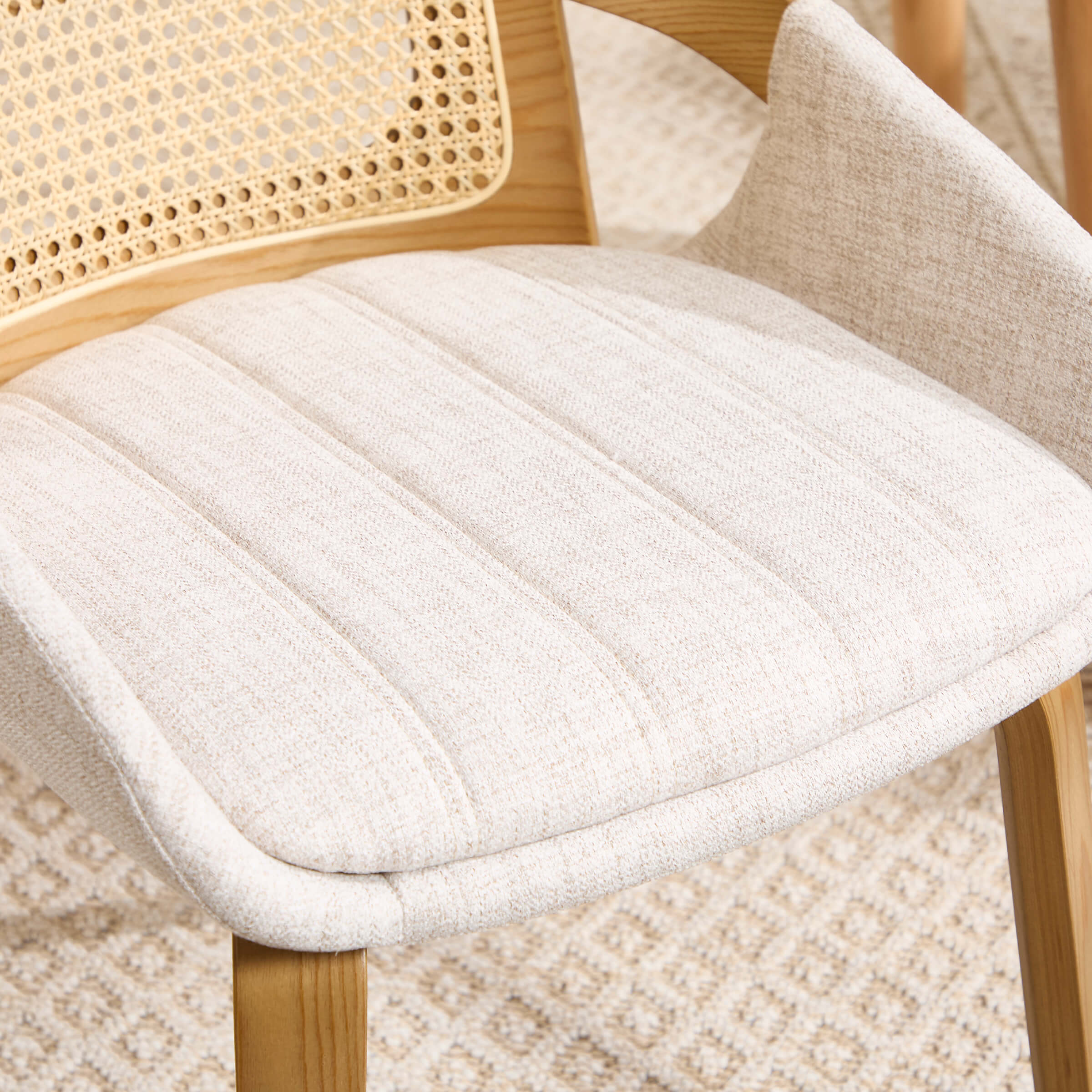 Close-up of cushioned seat and back edge of chair