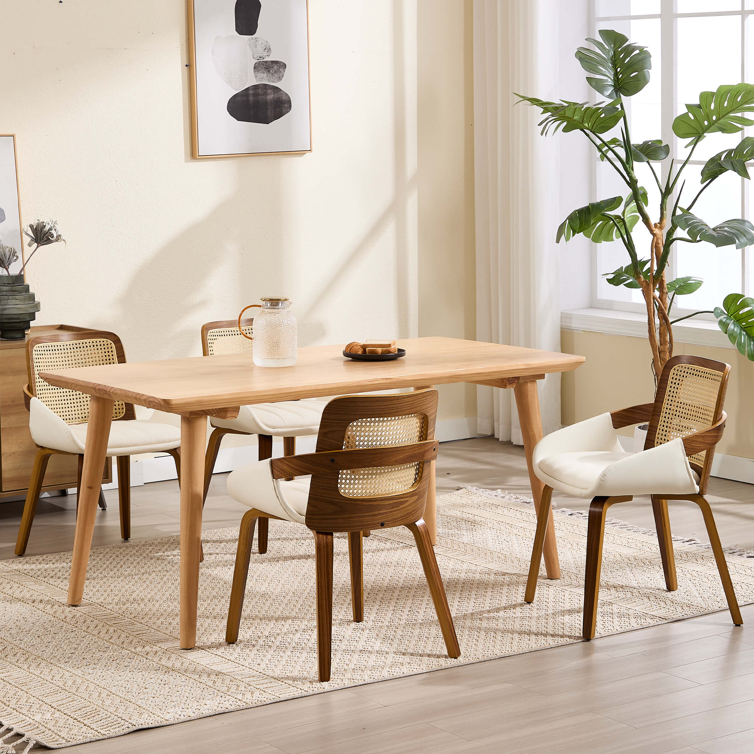 Dining area with large window plant