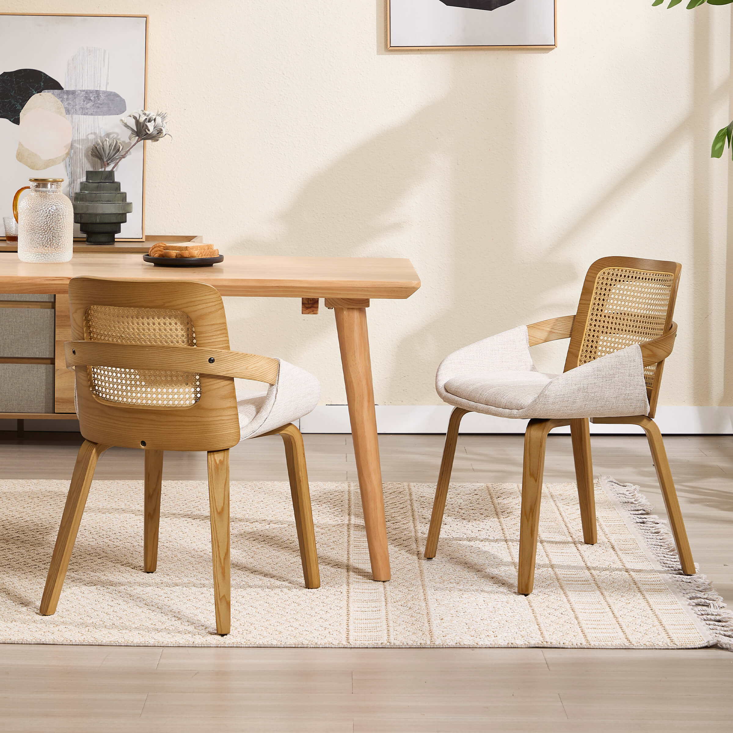 Dining table with six wooden chairs and rattan backrests in a modern dining room