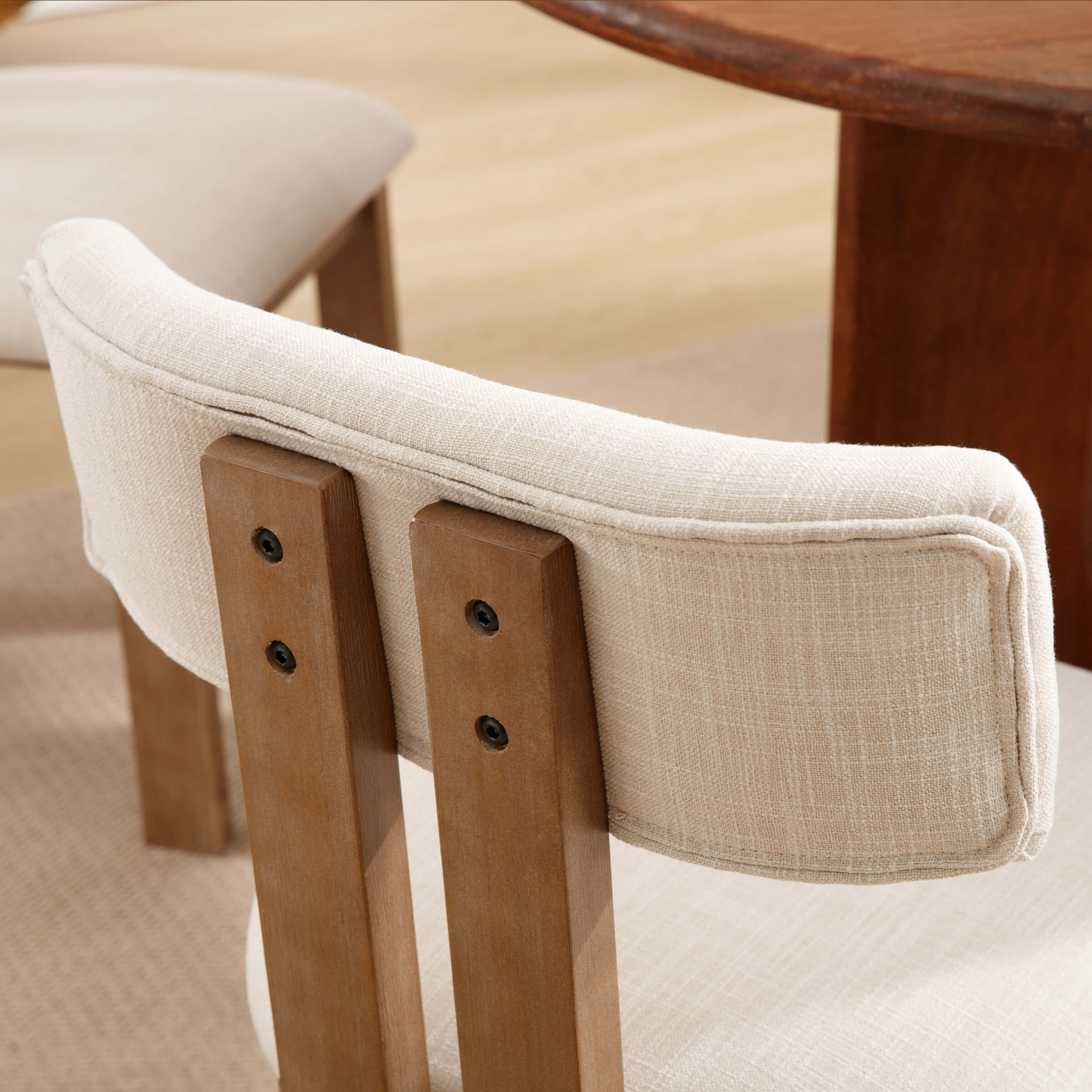 Back of chair showing wooden rails and upholstery