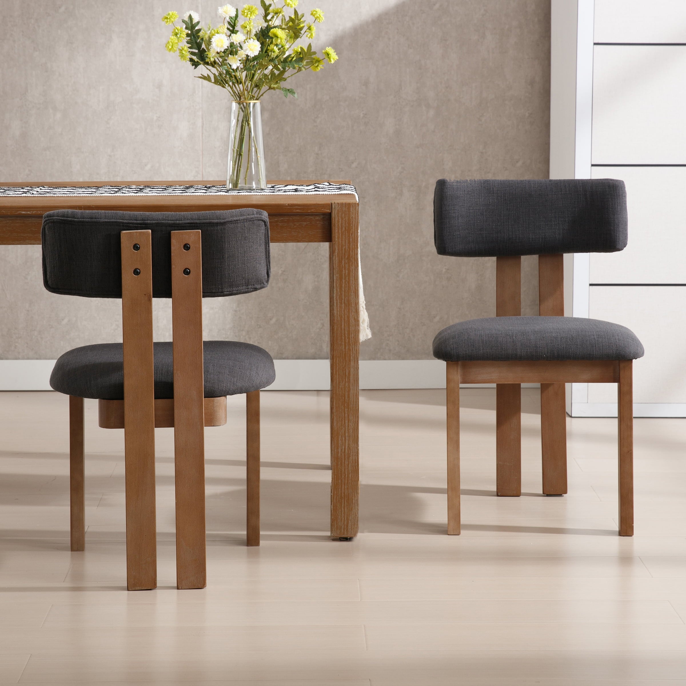 Two chairs in different color options with table