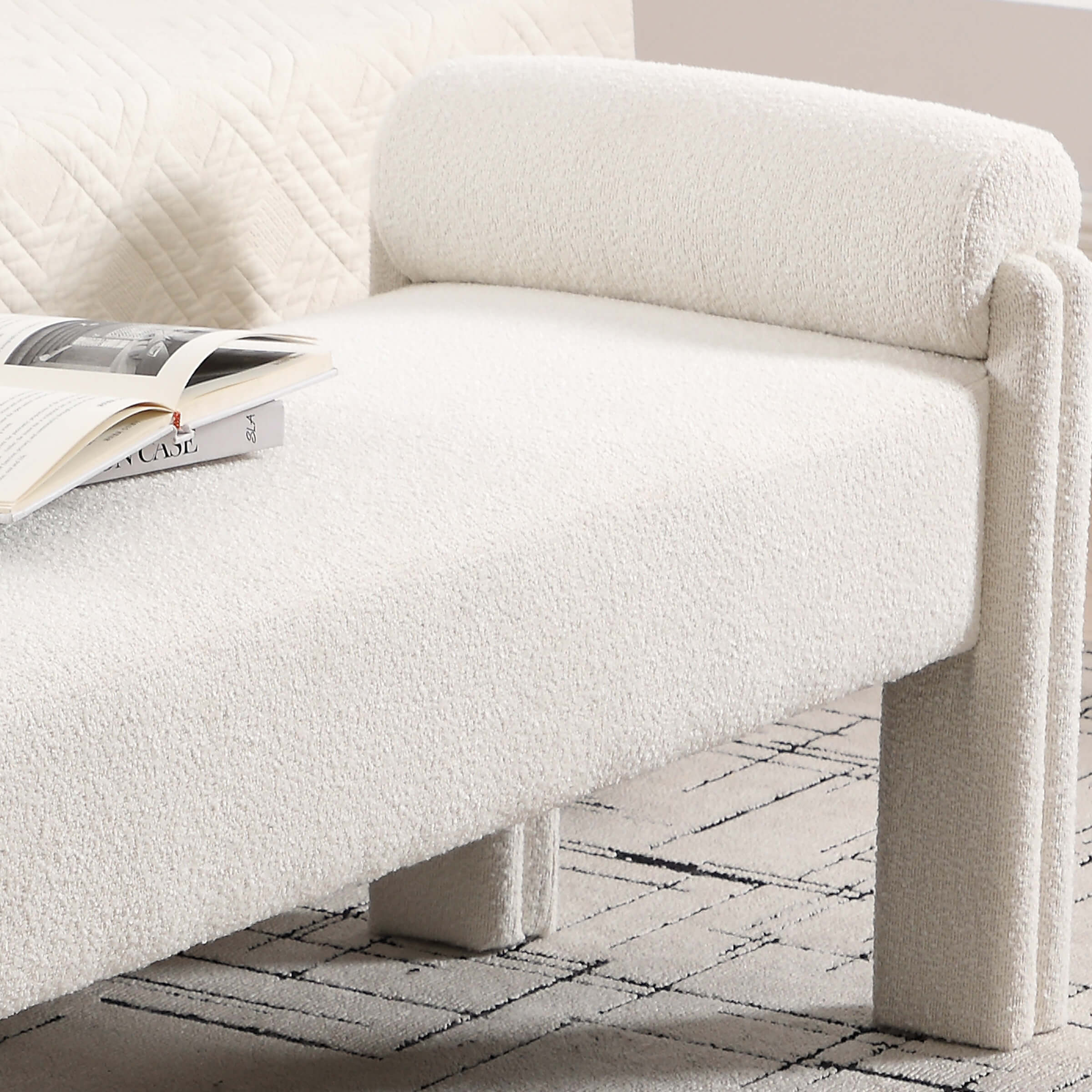 Side view of bench with armrest and back roller near headboard