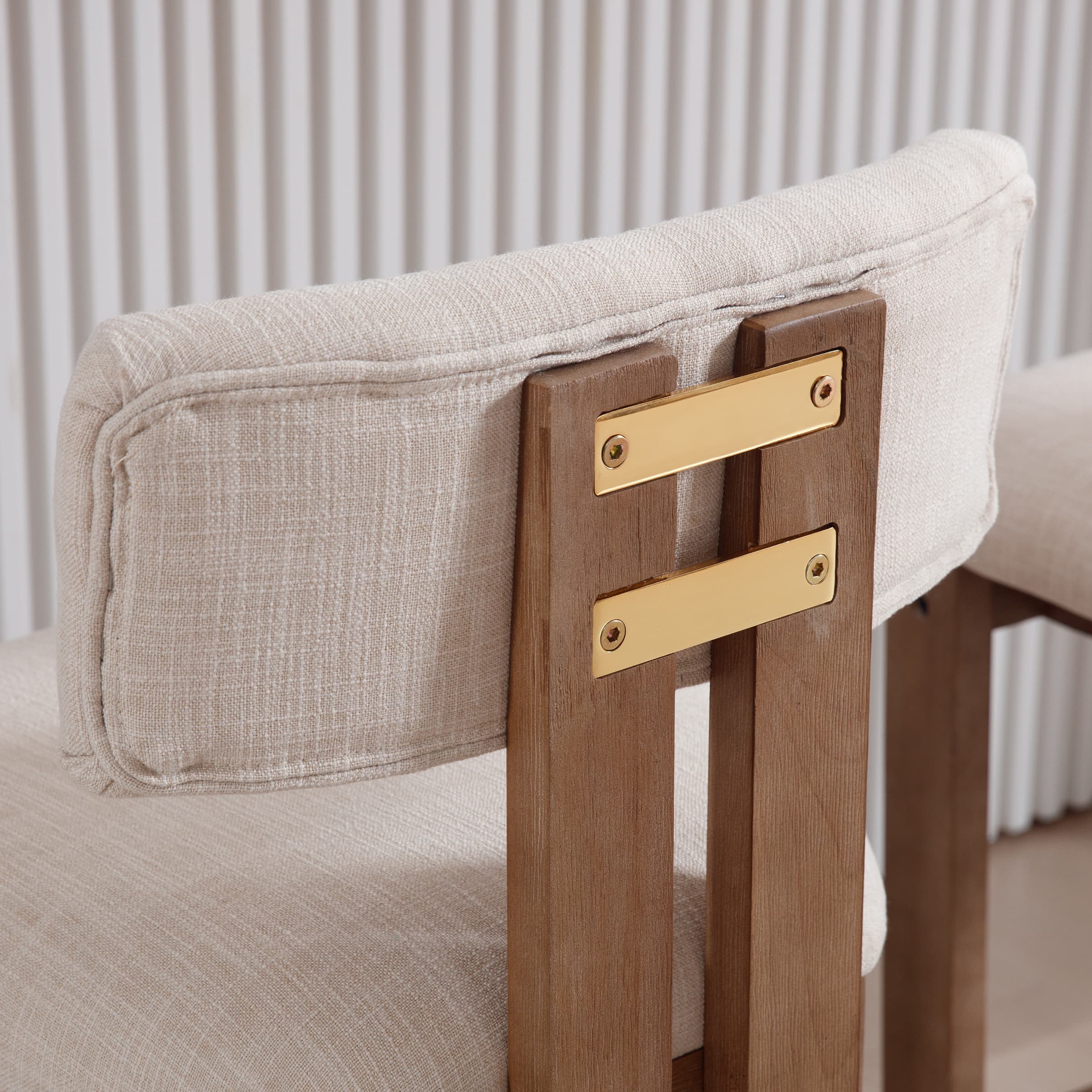 Back of stool showing gold metal brackets