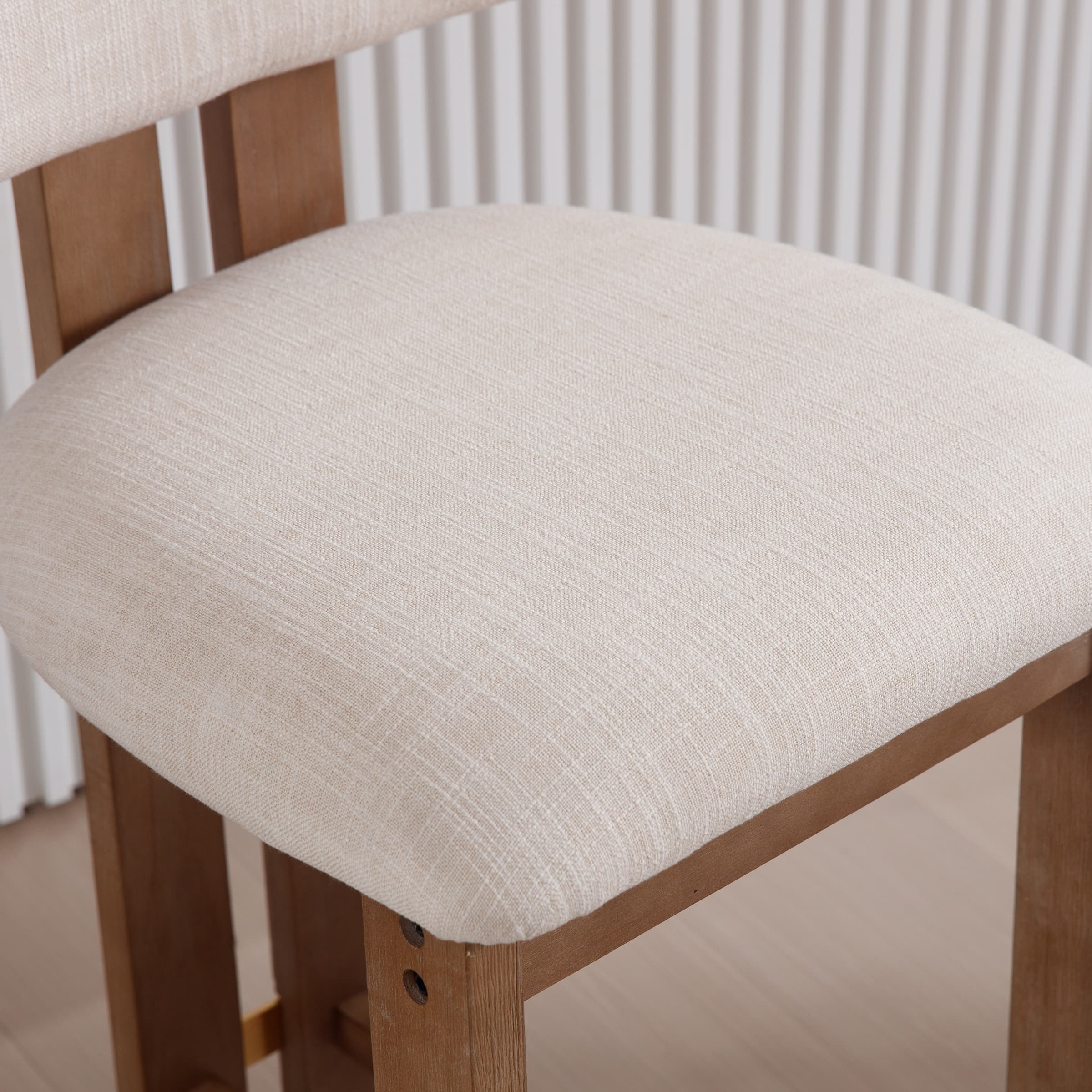 Beige cushioned seat close-up