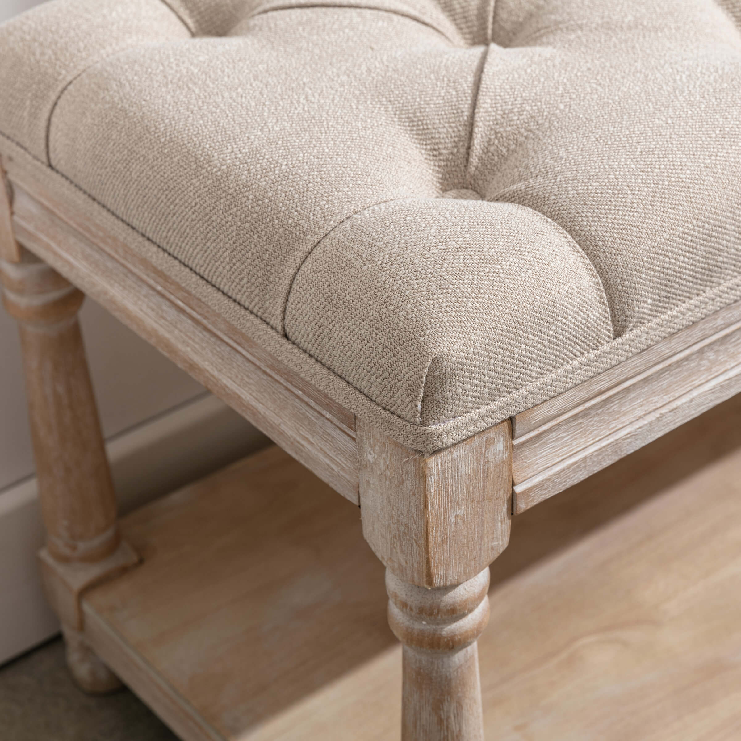 Close-up of tufted cushion texture and corner