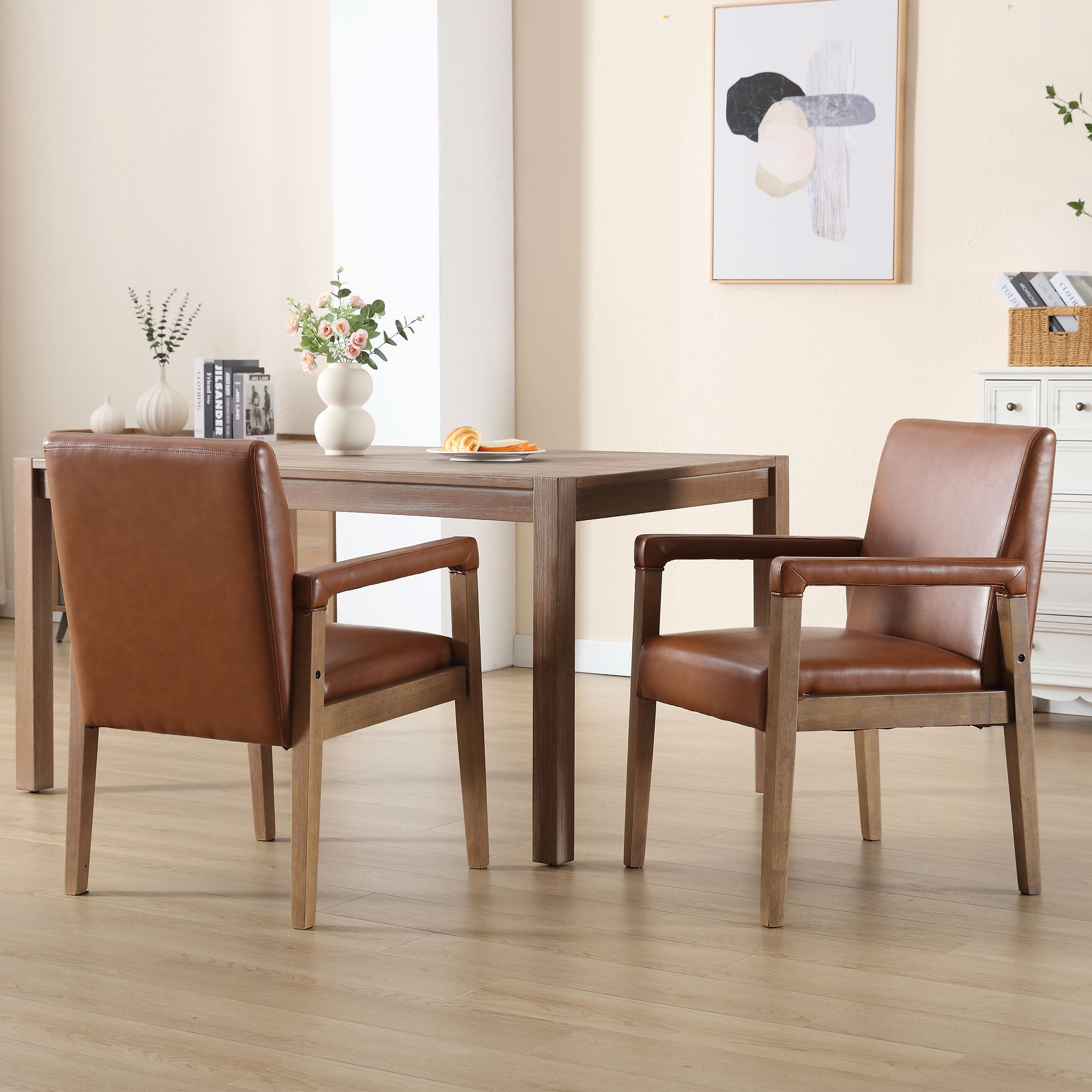 Dining set with four chairs around a table in a room