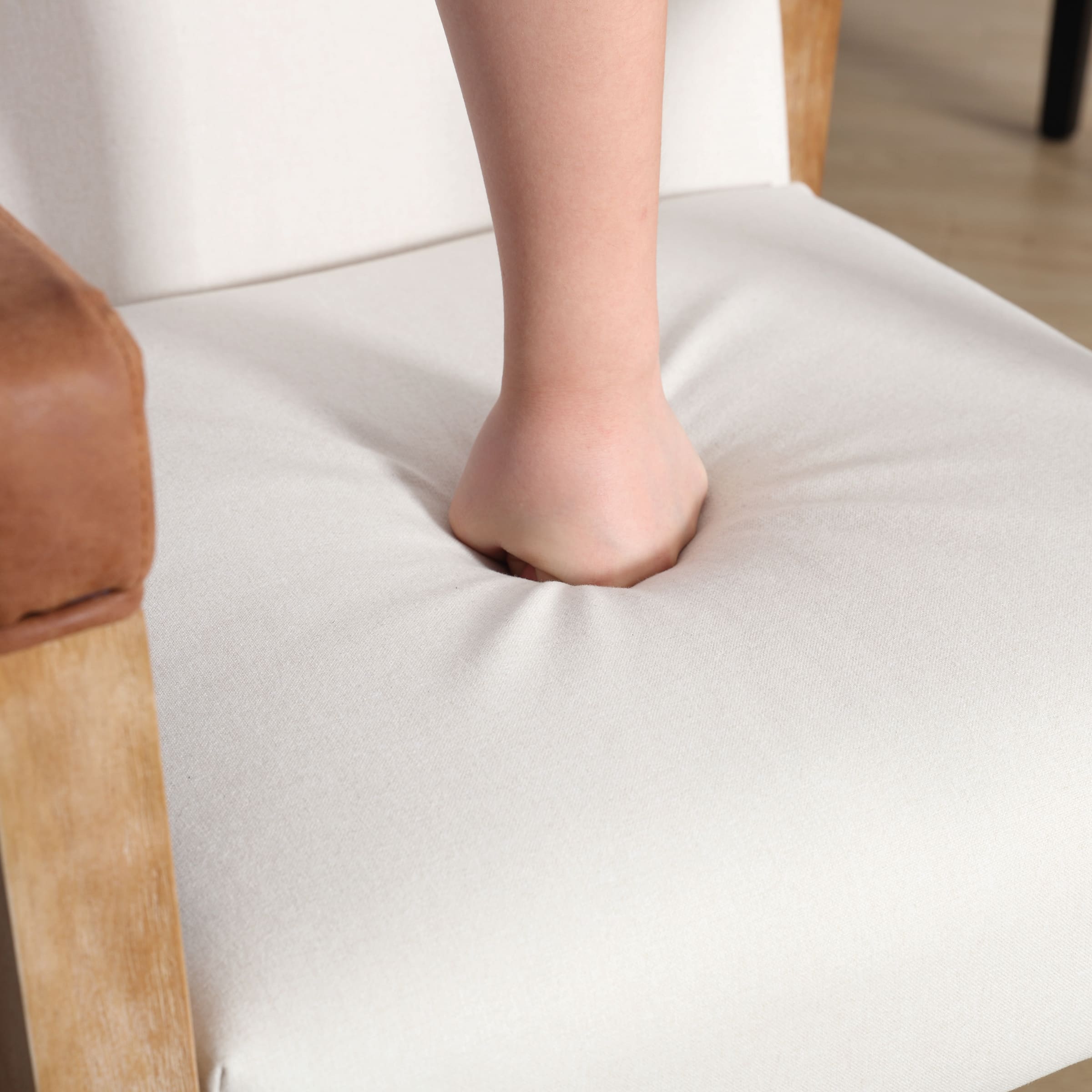 Close-up of chair seat with hole in cushion
