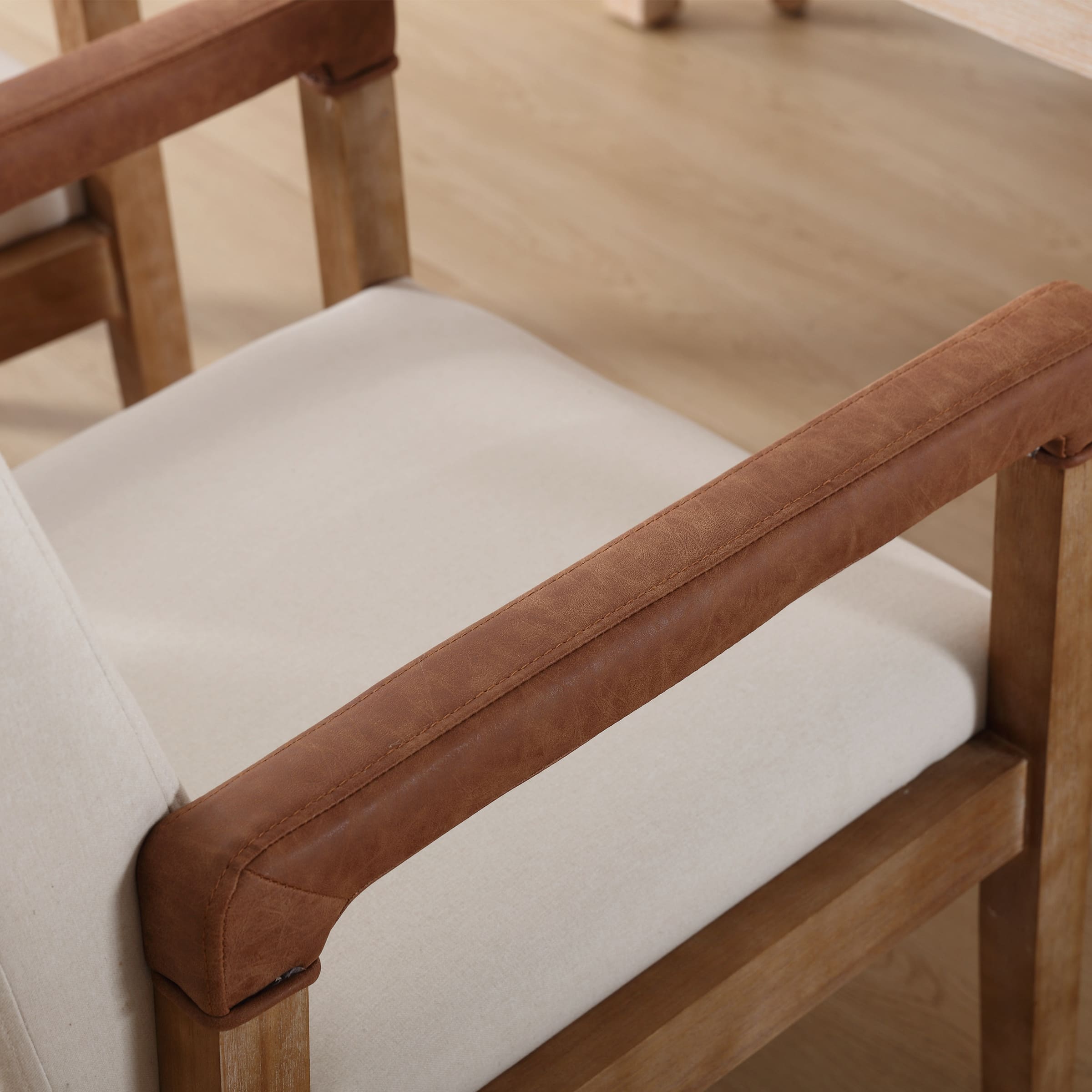 Armrest and chair leg with leather padding