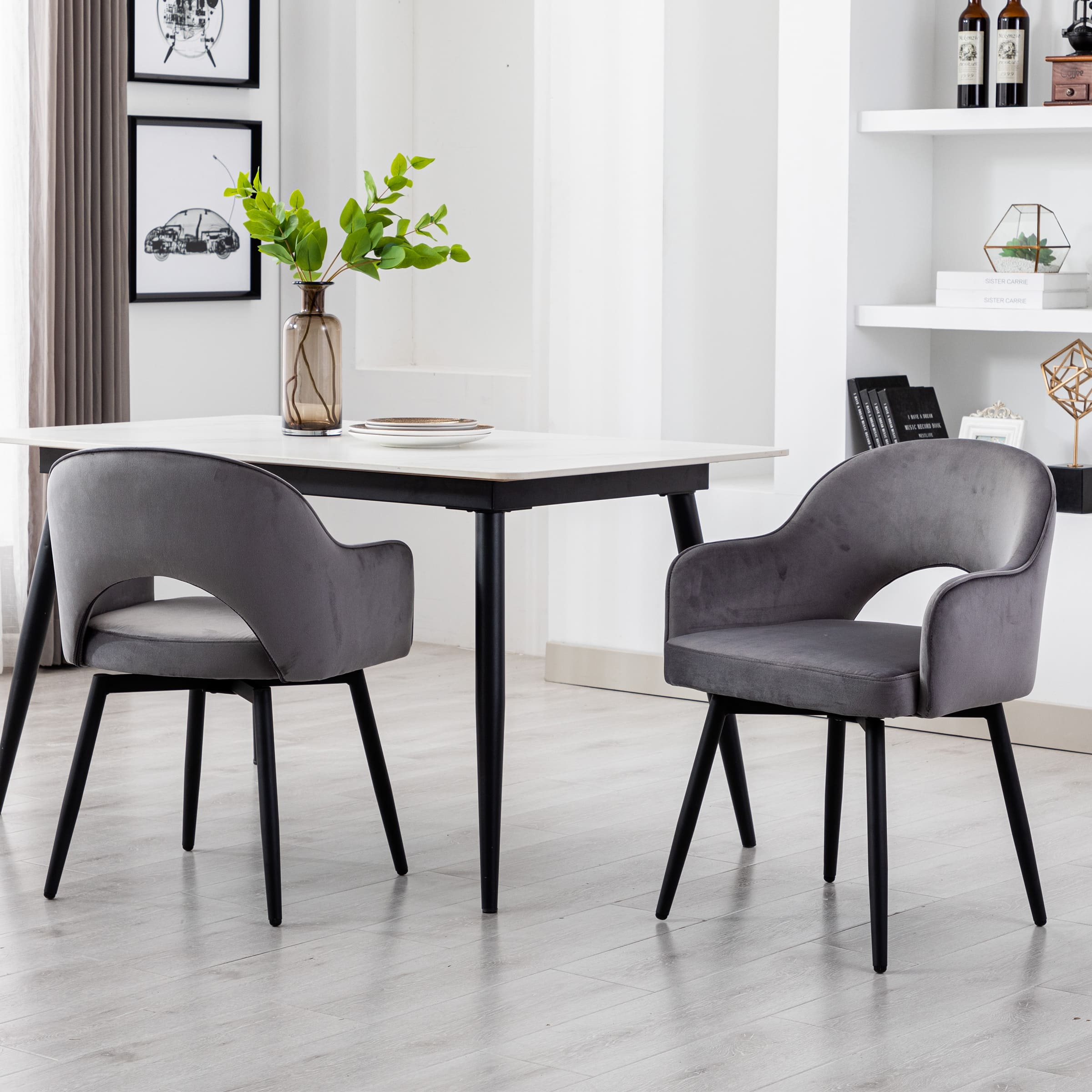 Two grey swivel chairs around a dining table