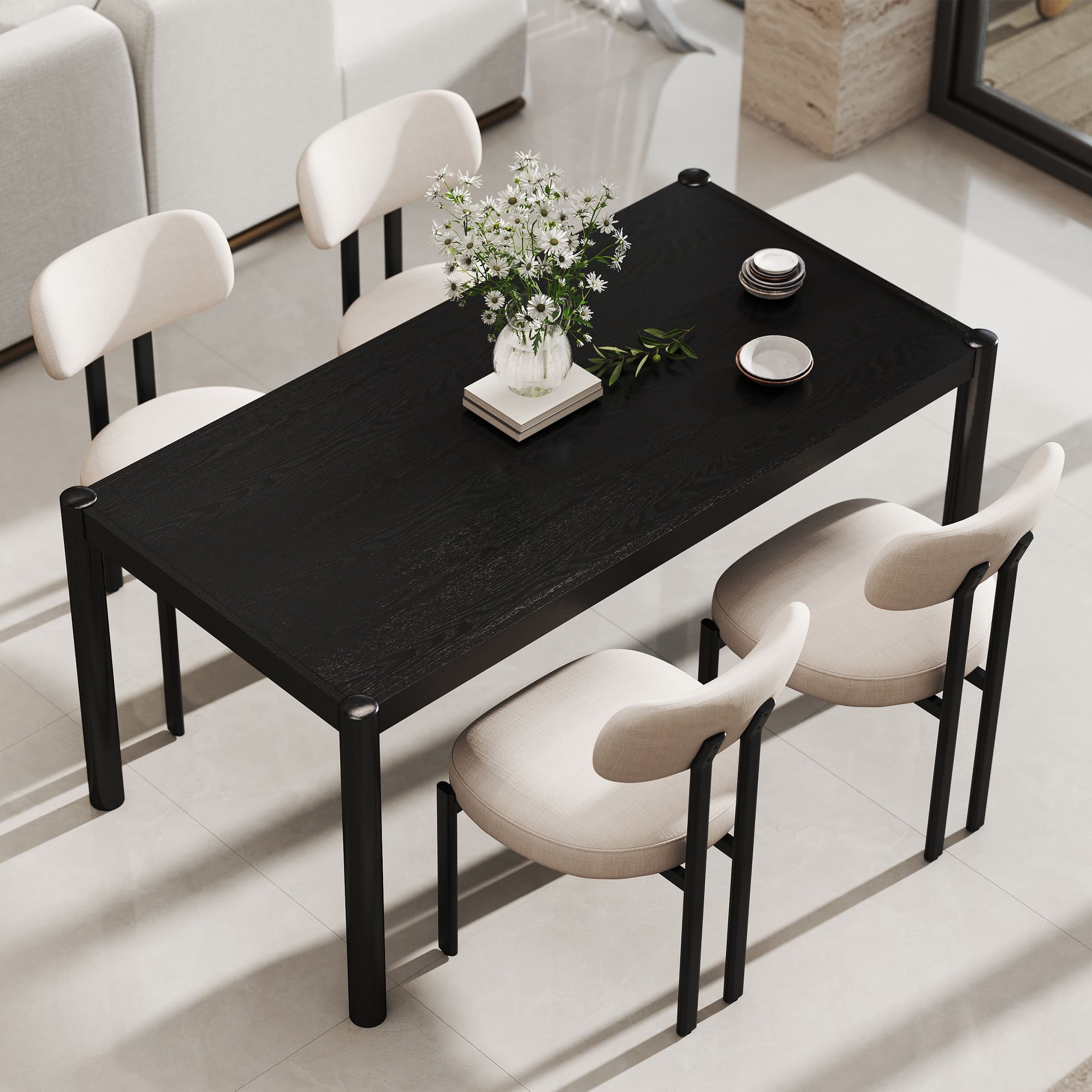 Black dining table with chairs around