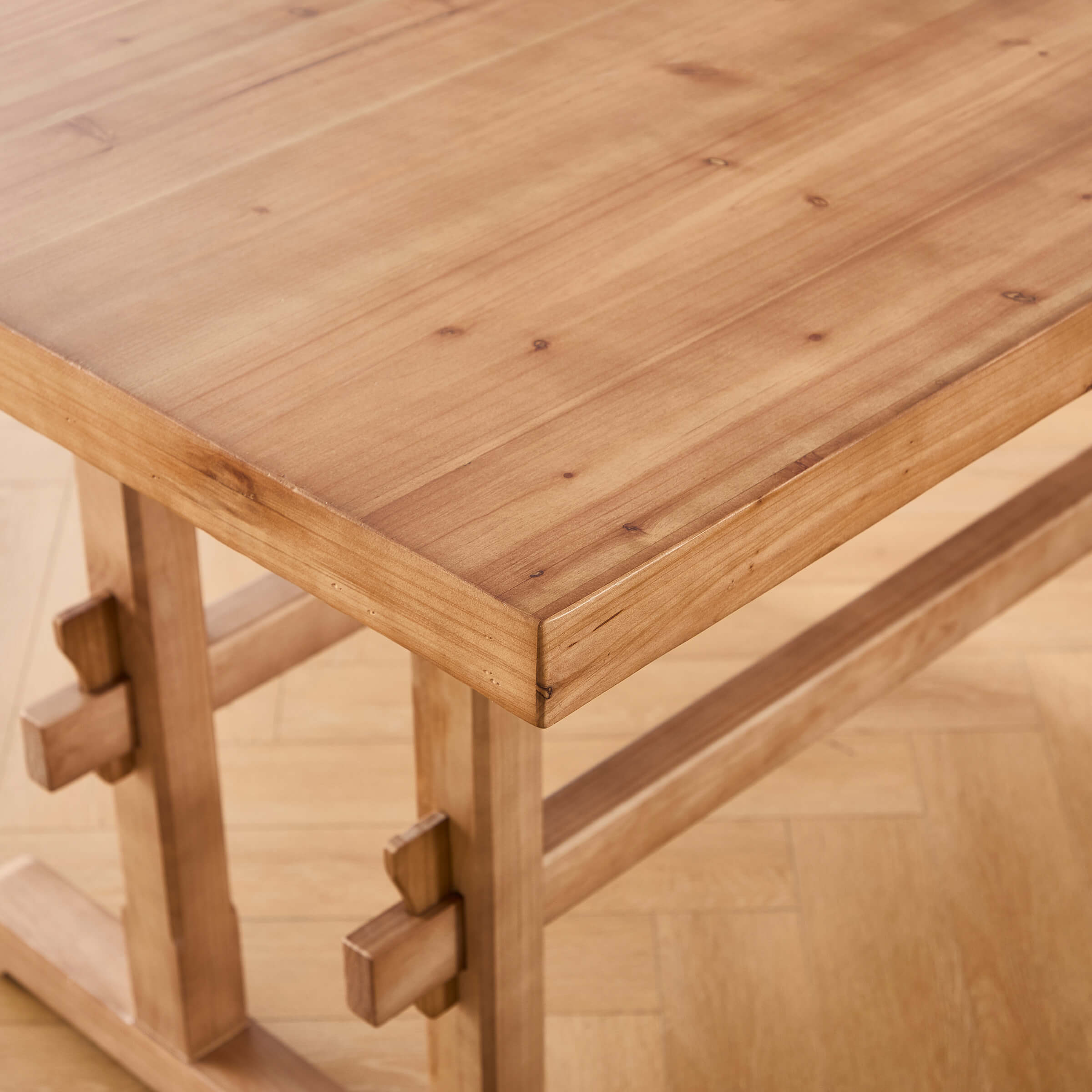 Corner and edge of table showing wood grain